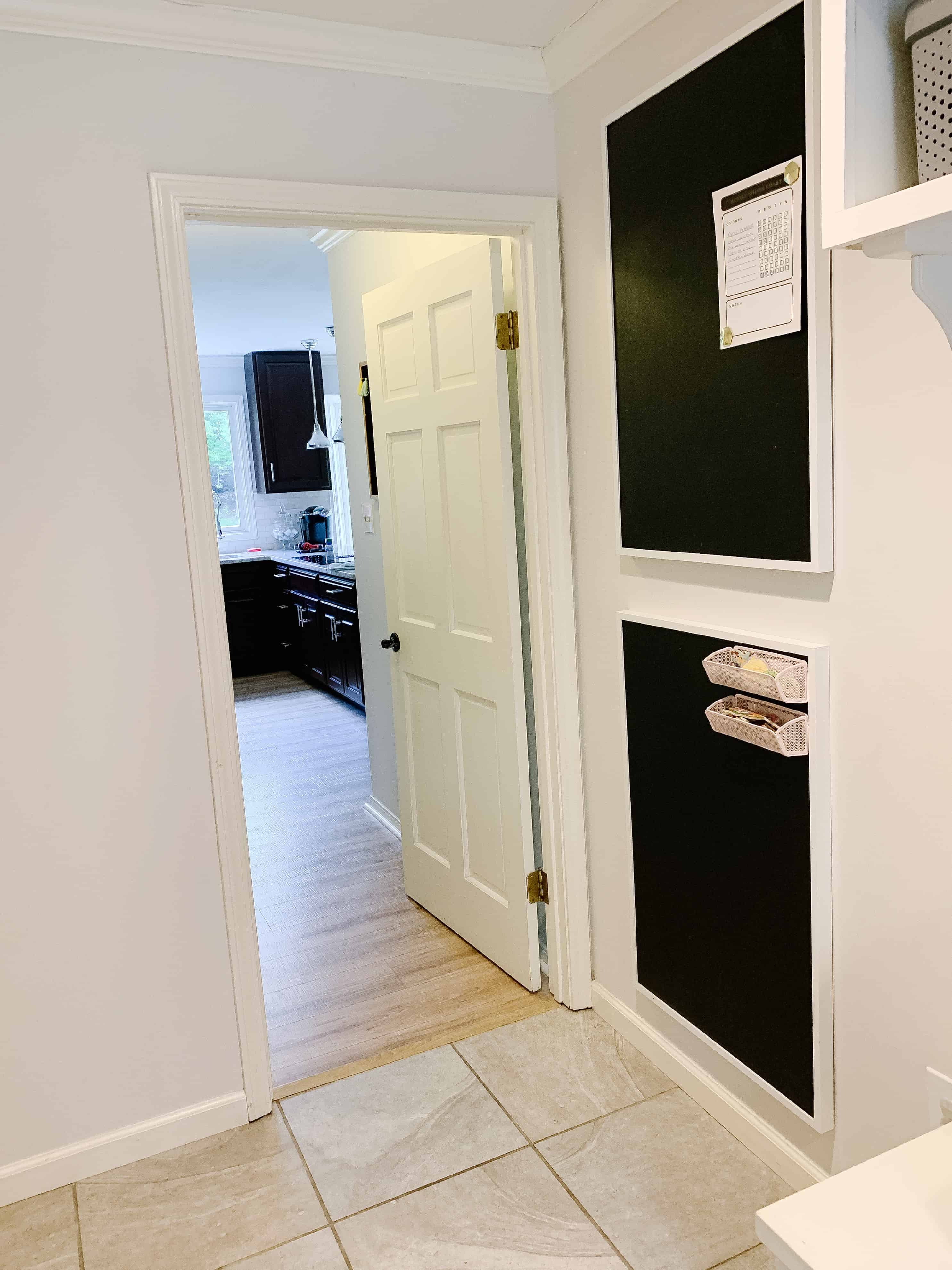 Laundry room with framed chalkboards