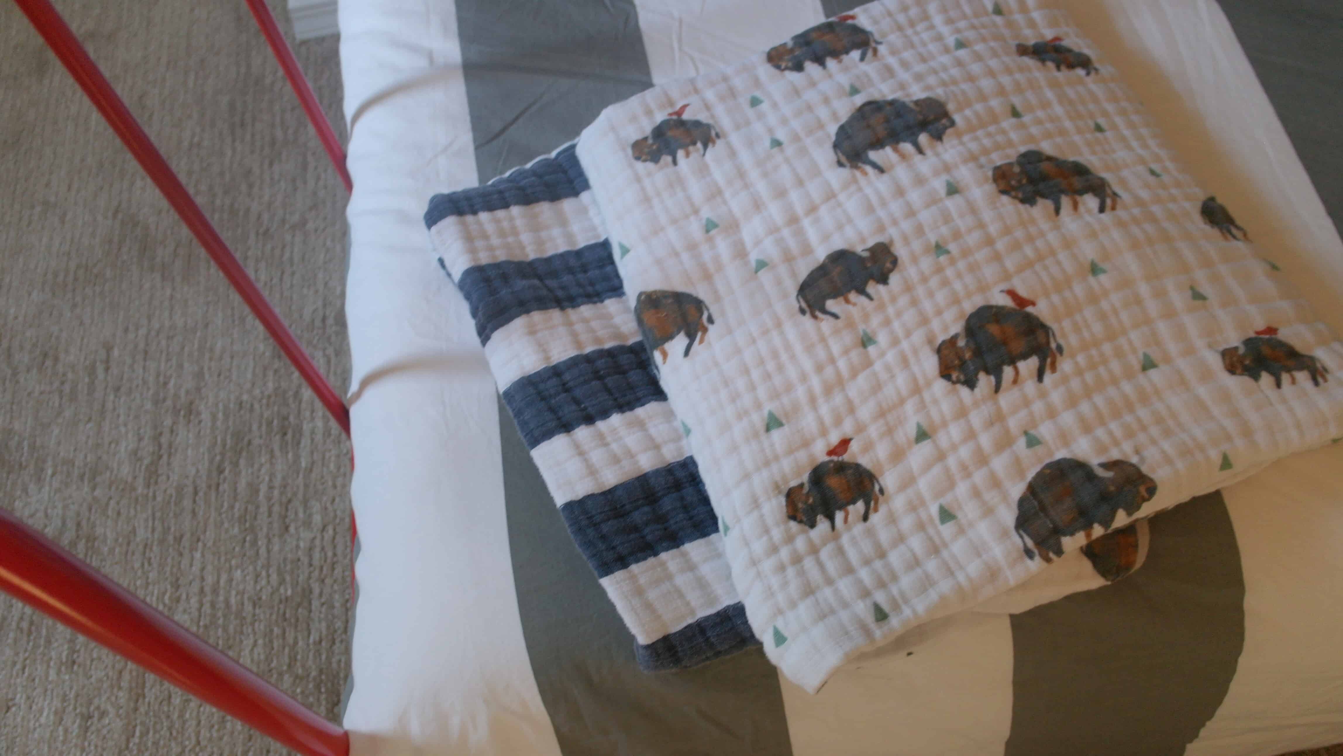 little unicorn blankets on bed