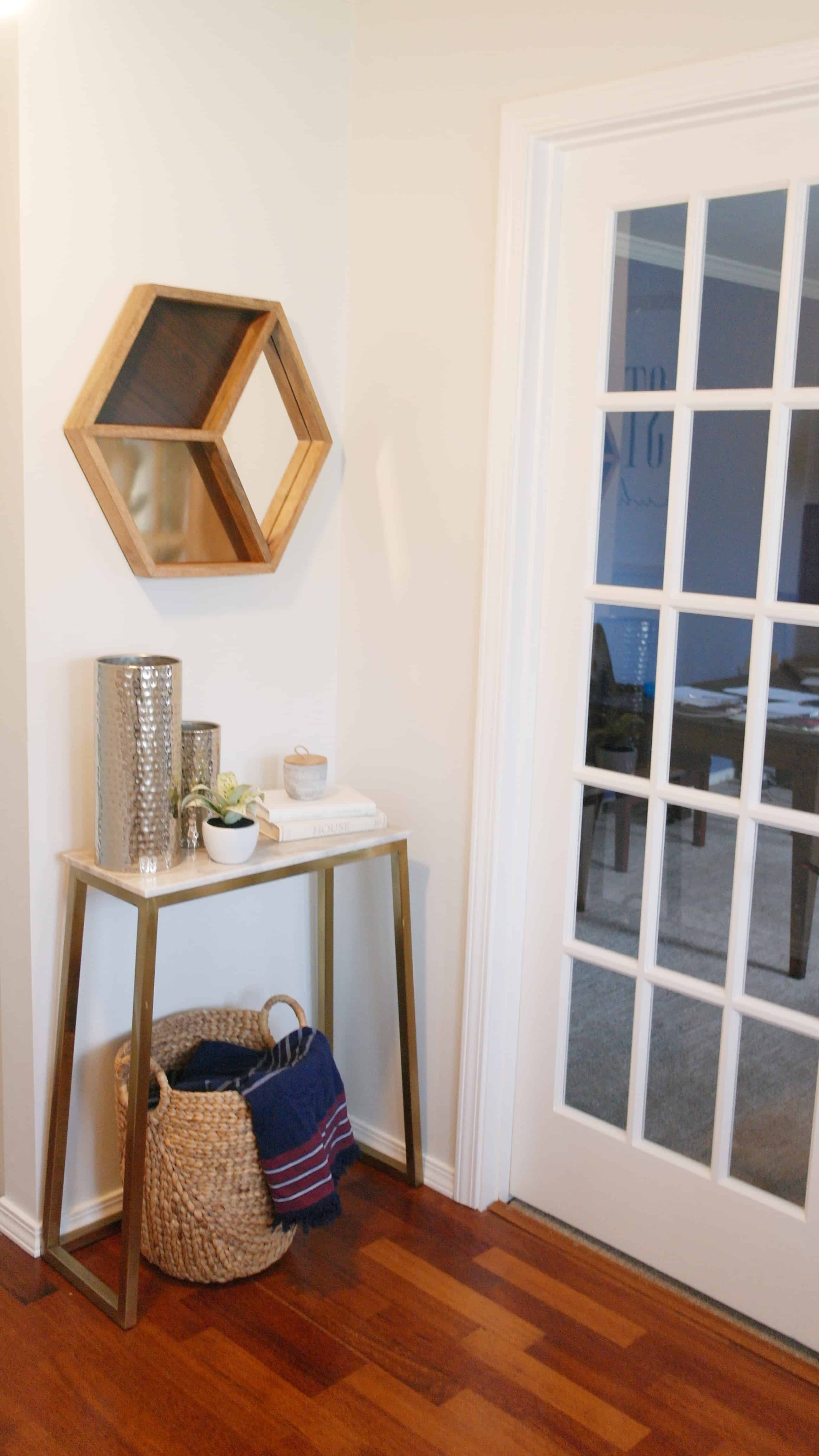 small gold entry way table with modern decor