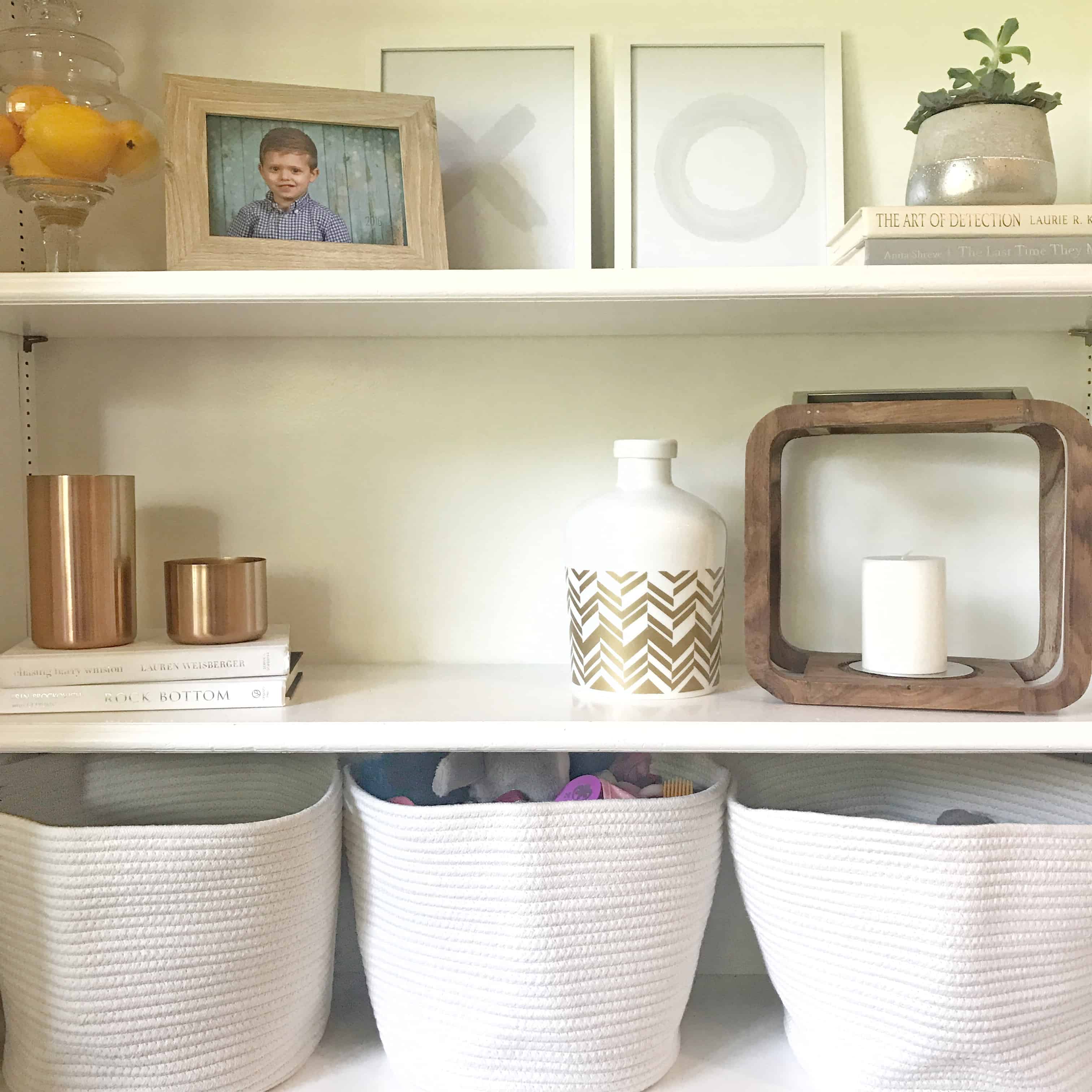 shelves with white baskets for toy storage | Toy Storage Guide 