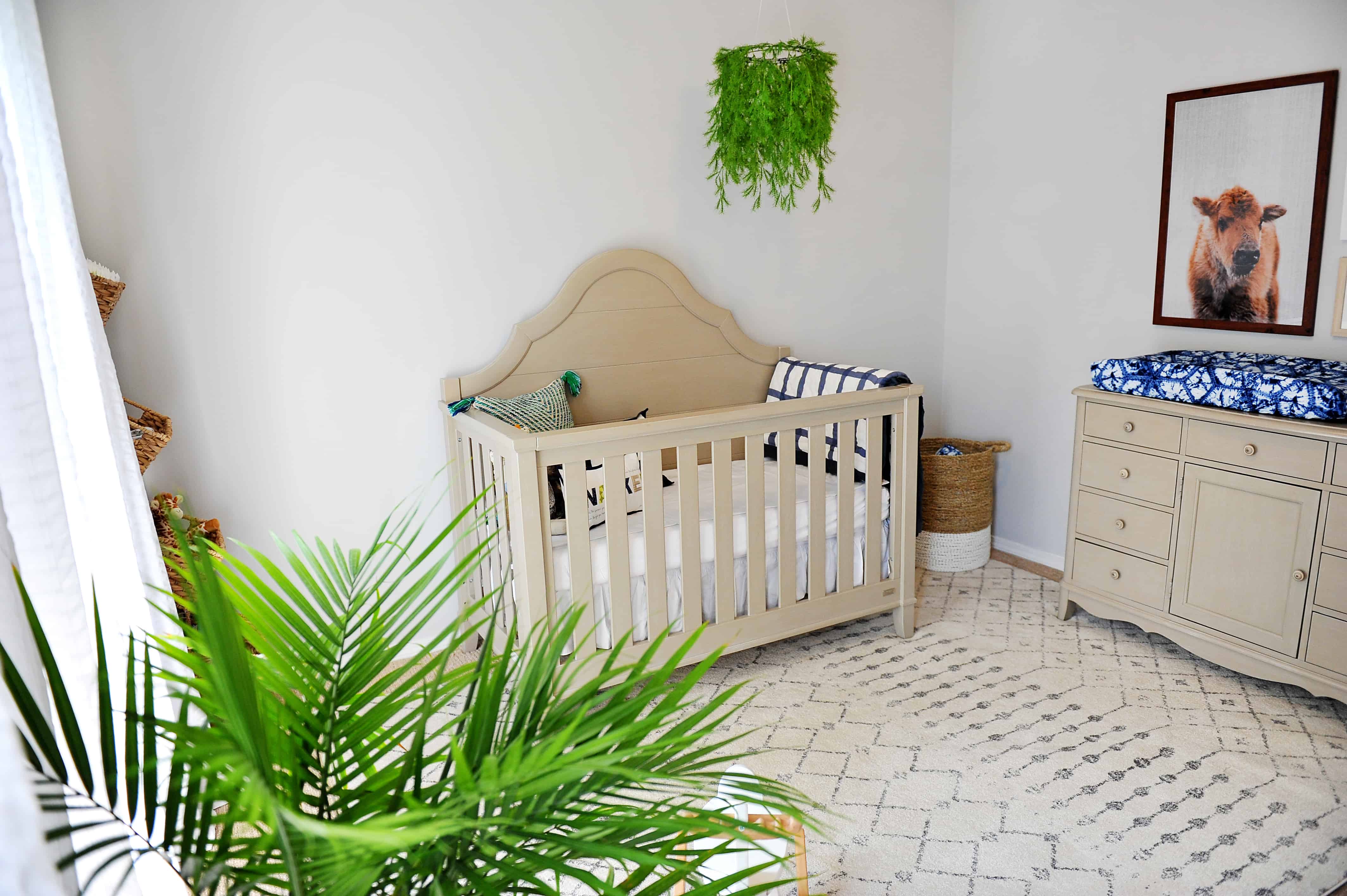 nursery with buffalo print and greenery