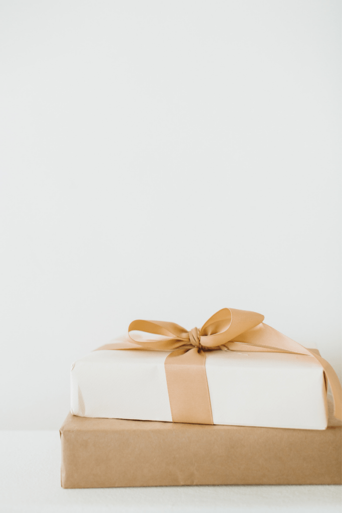 white backdrop with neutral gifts 