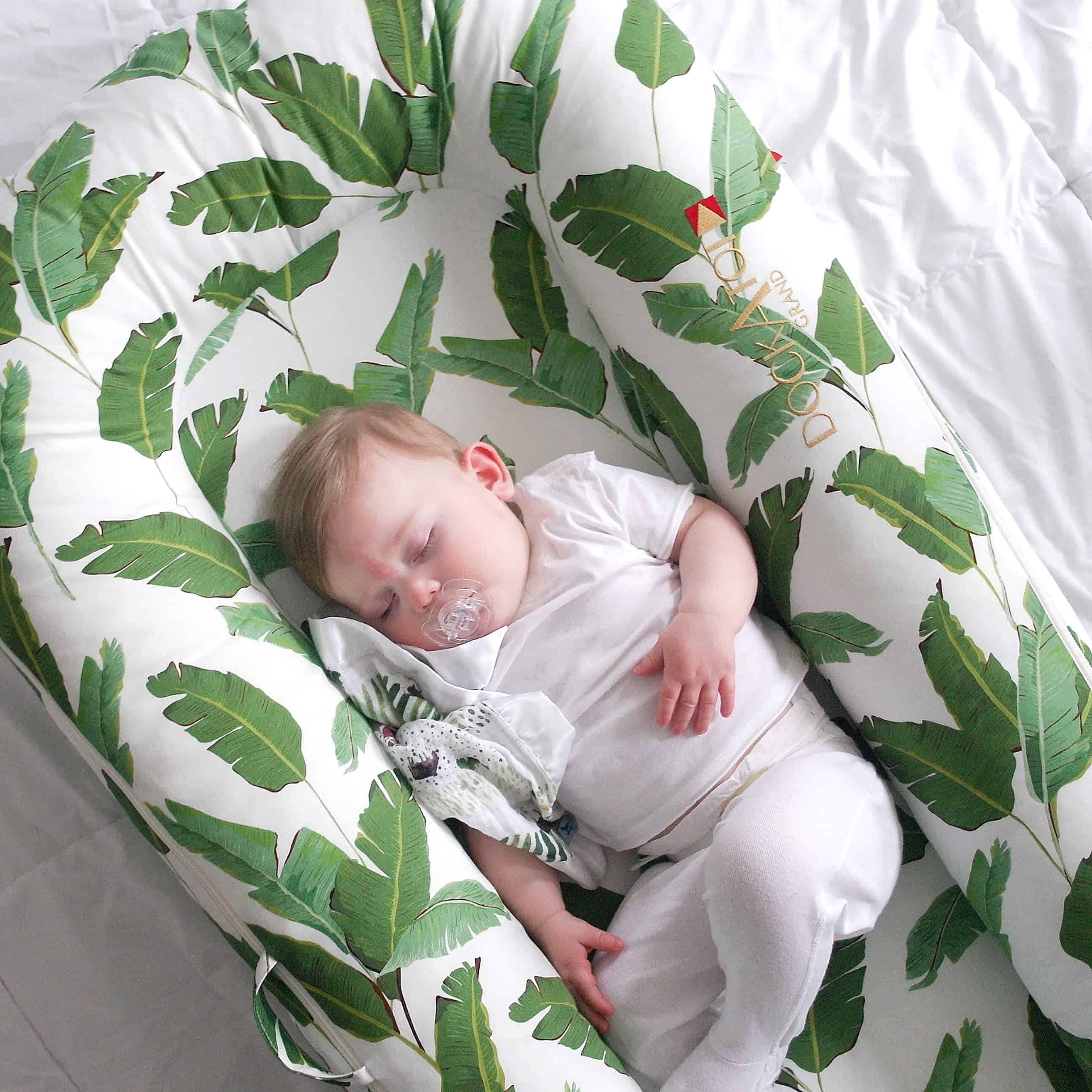 Baby sleeping in dockatot in crib best sale