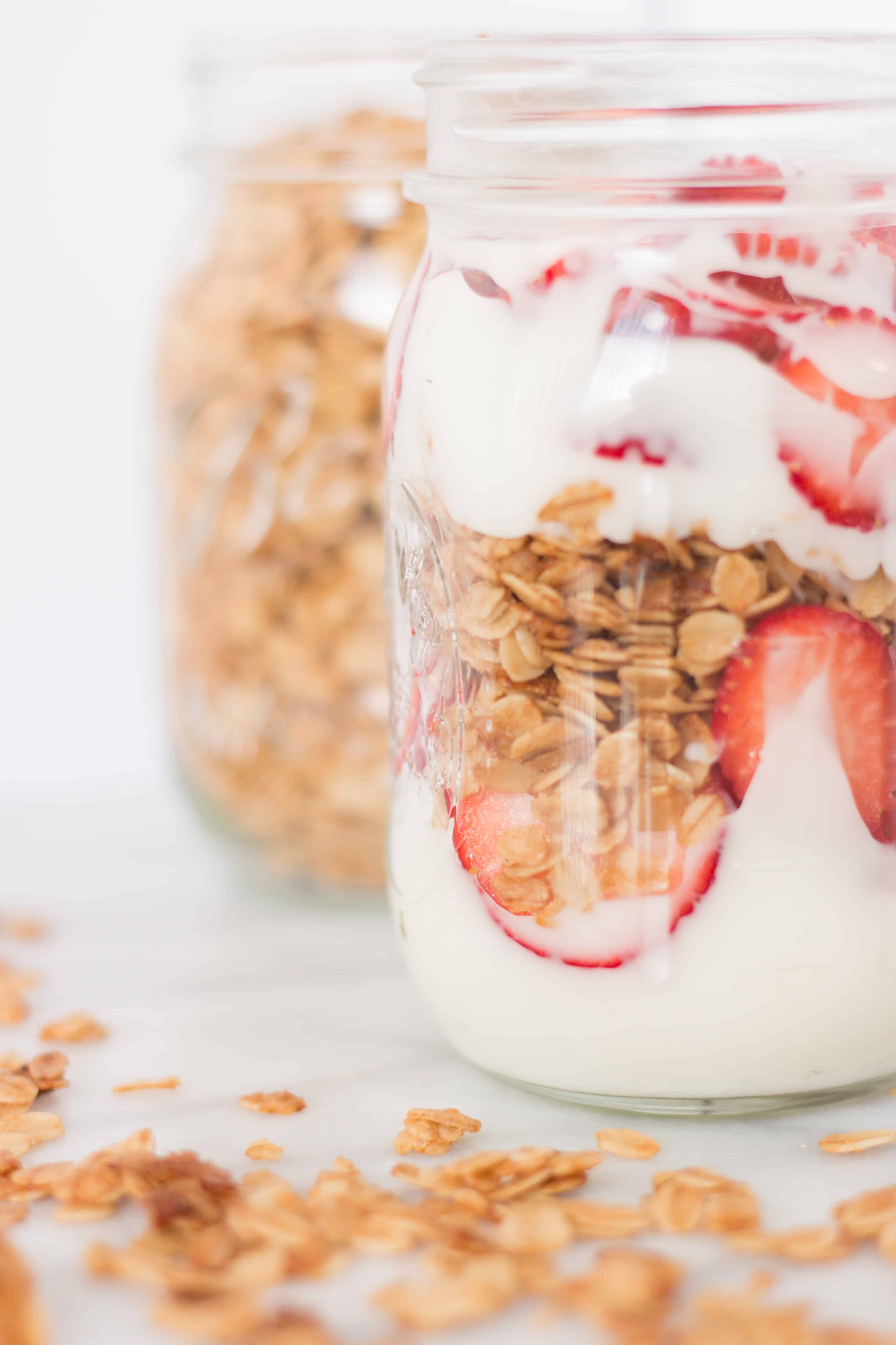 Granola and yogurt parfait in mason jars