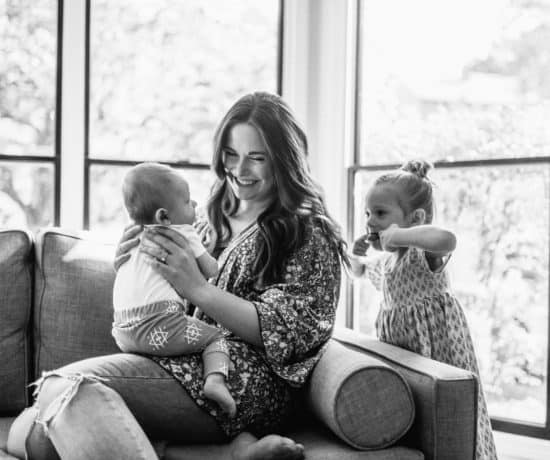 mom with baby and toddler having fun