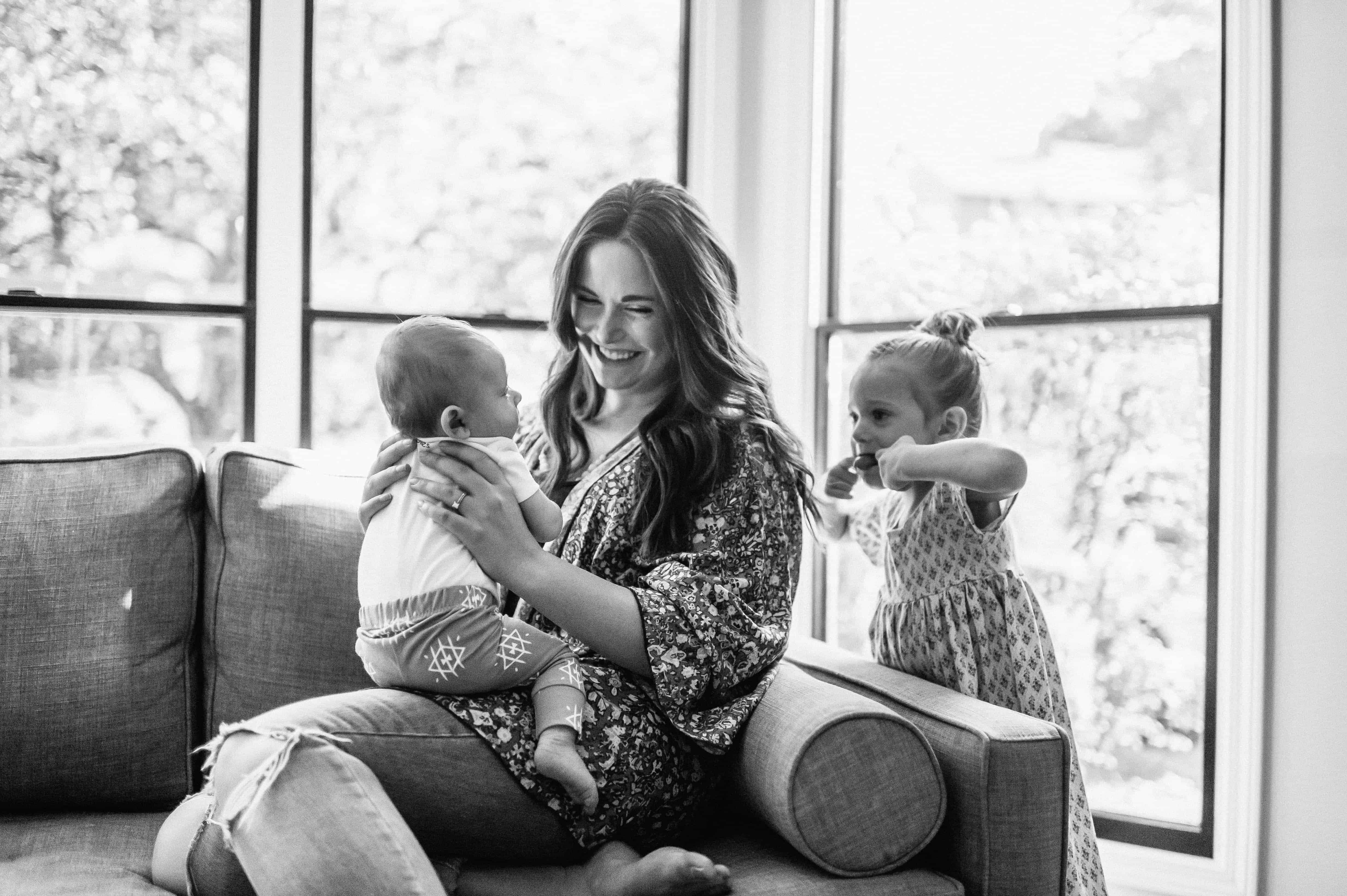 mom with baby and toddler having fun