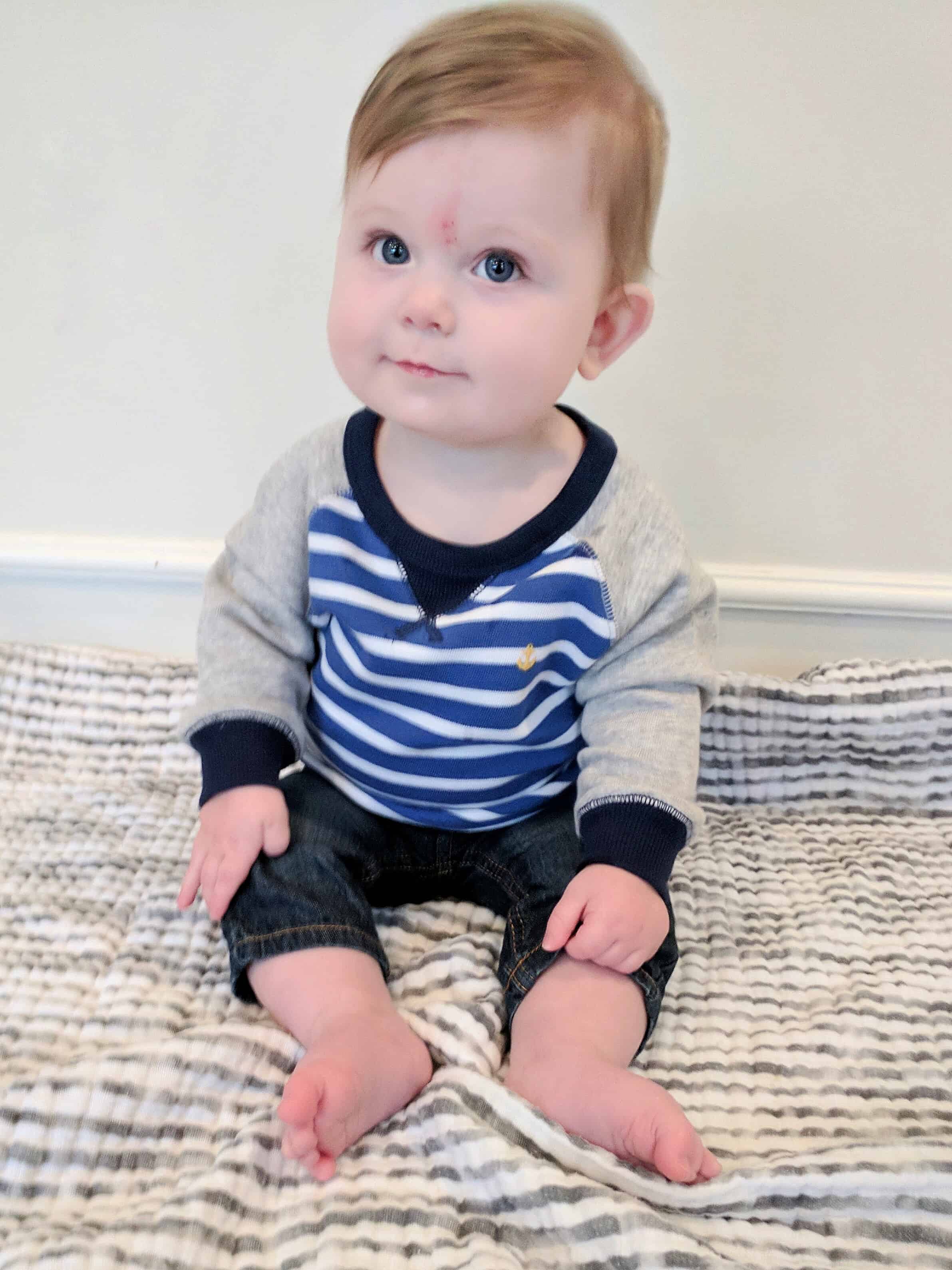 Baby boy in blue striped sweatshirt 