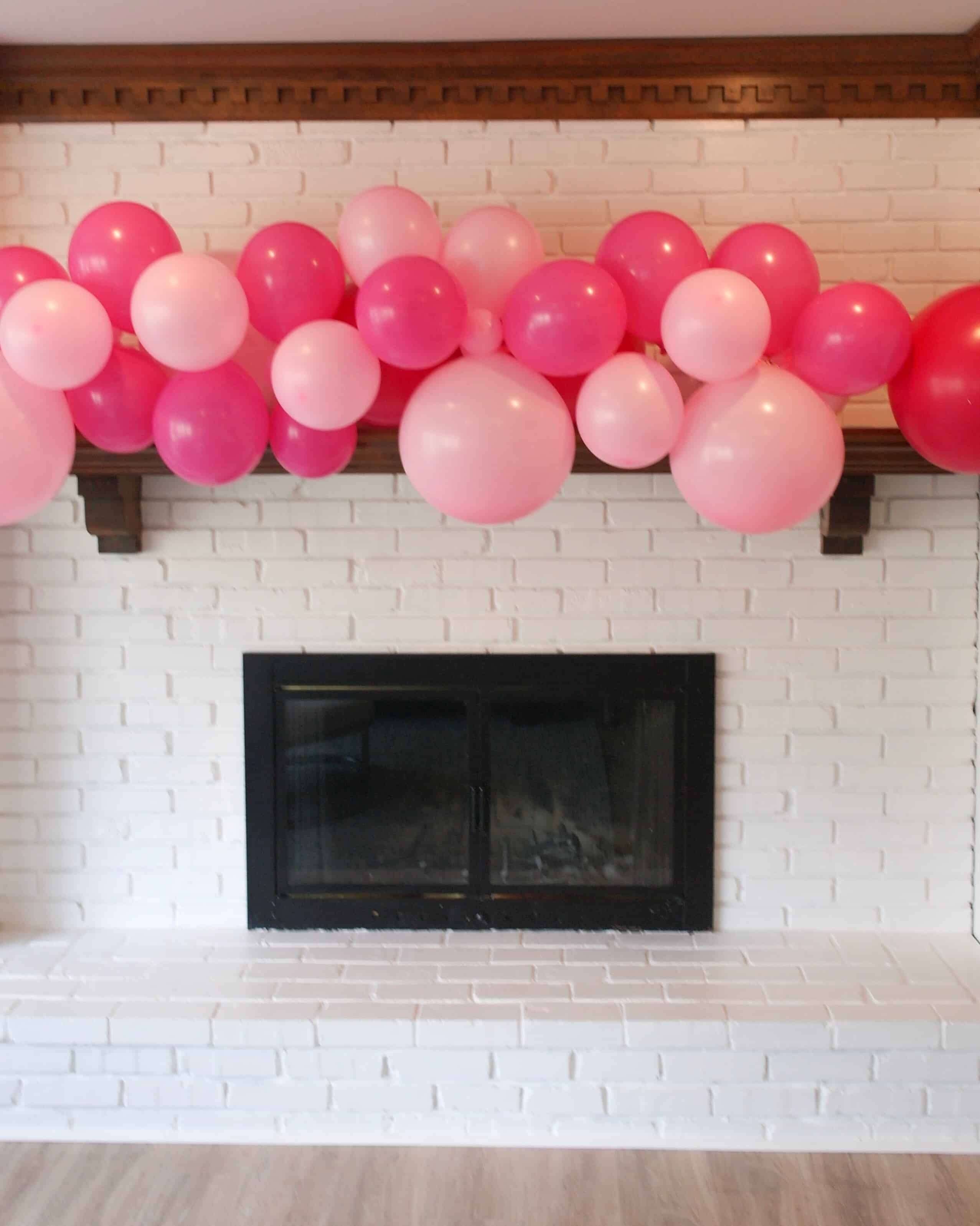 white brick mantle with pink balloons | Valentines Day Party 