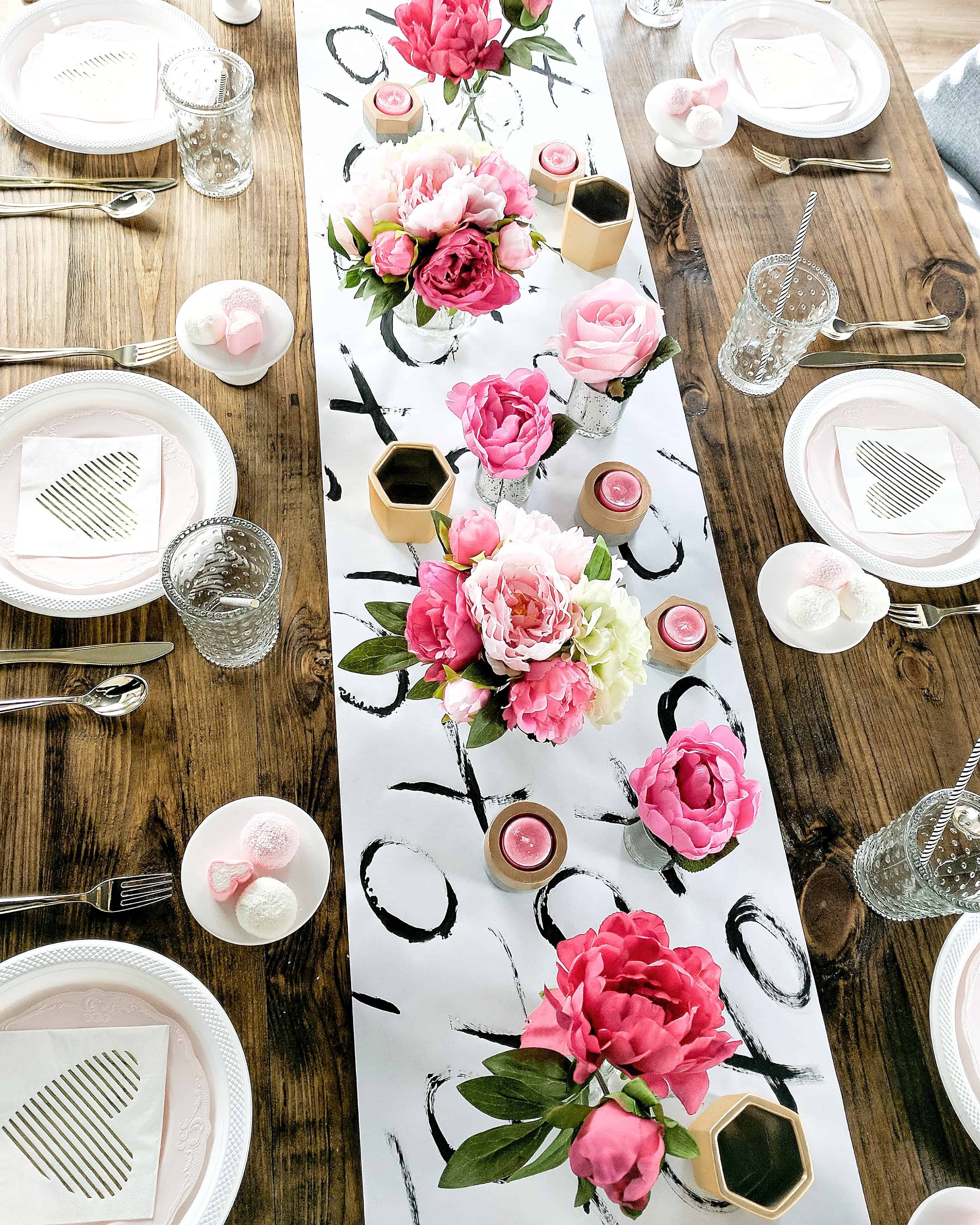 Table setting with wood table black and white table runner and floral and gold accents | Valentine's Day Party 