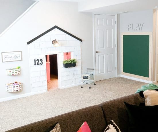playroom with house and chalkboard wall