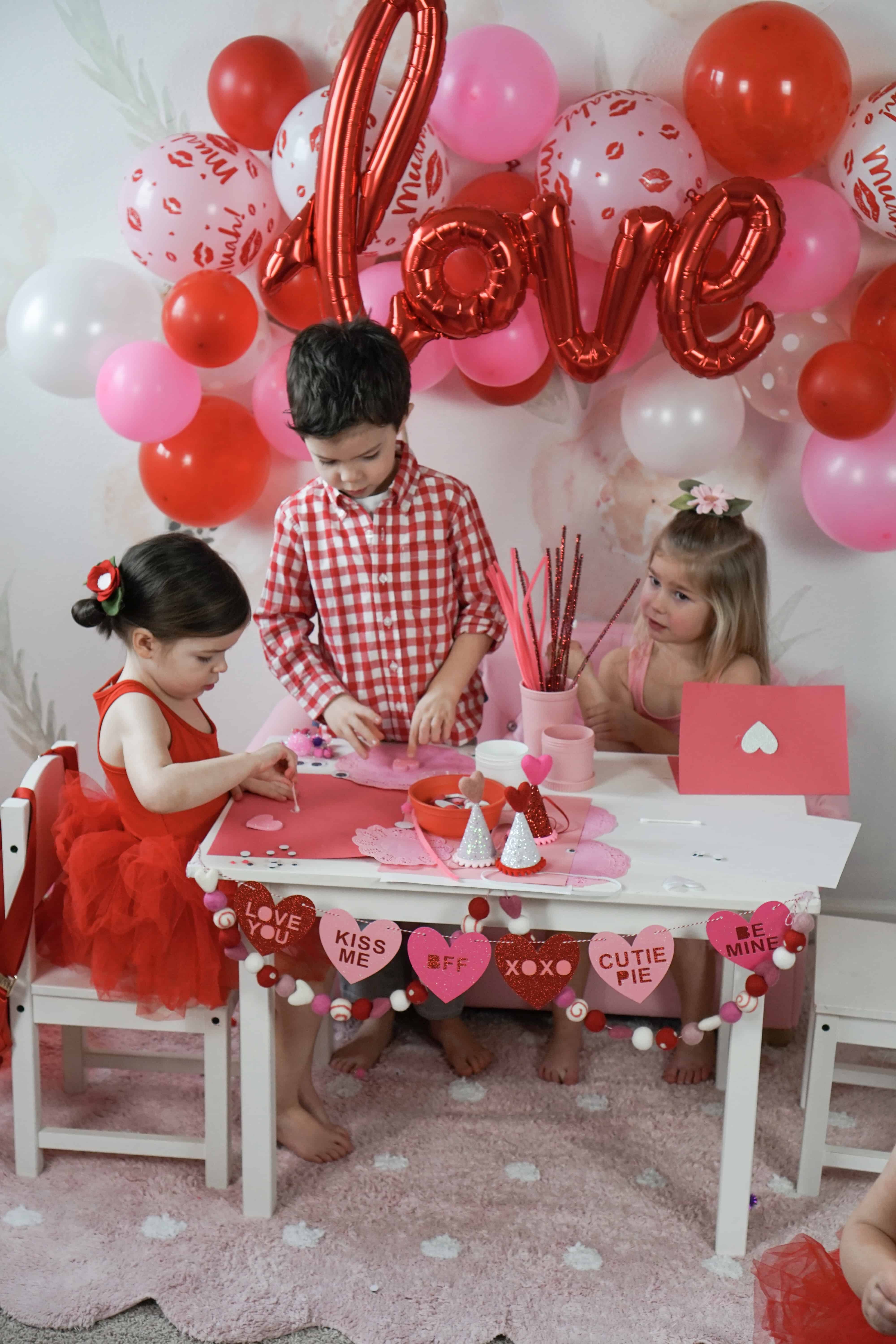 toddlers doing a valentines day craft