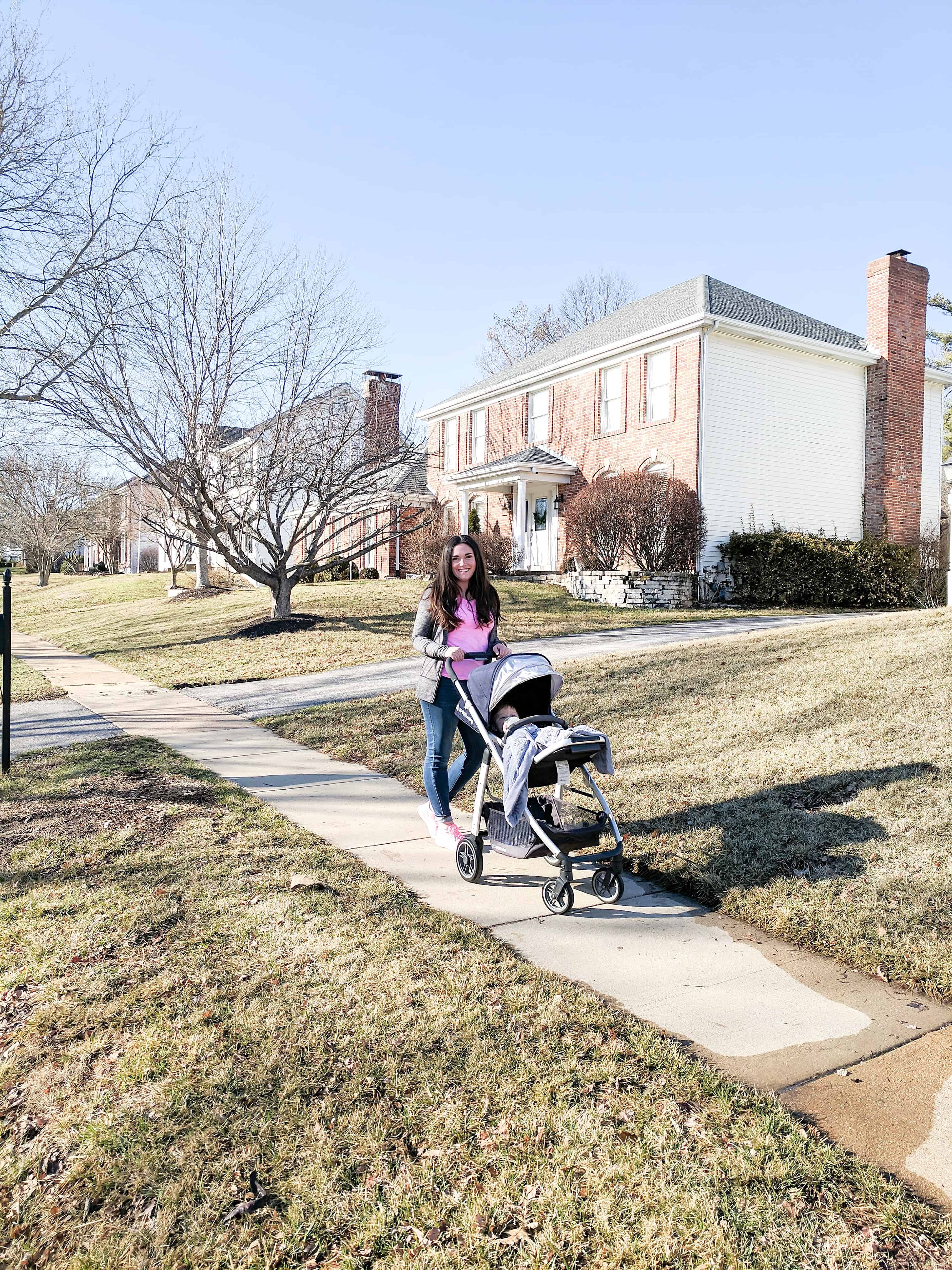 mom pushing stroller | Buying a Stroller 