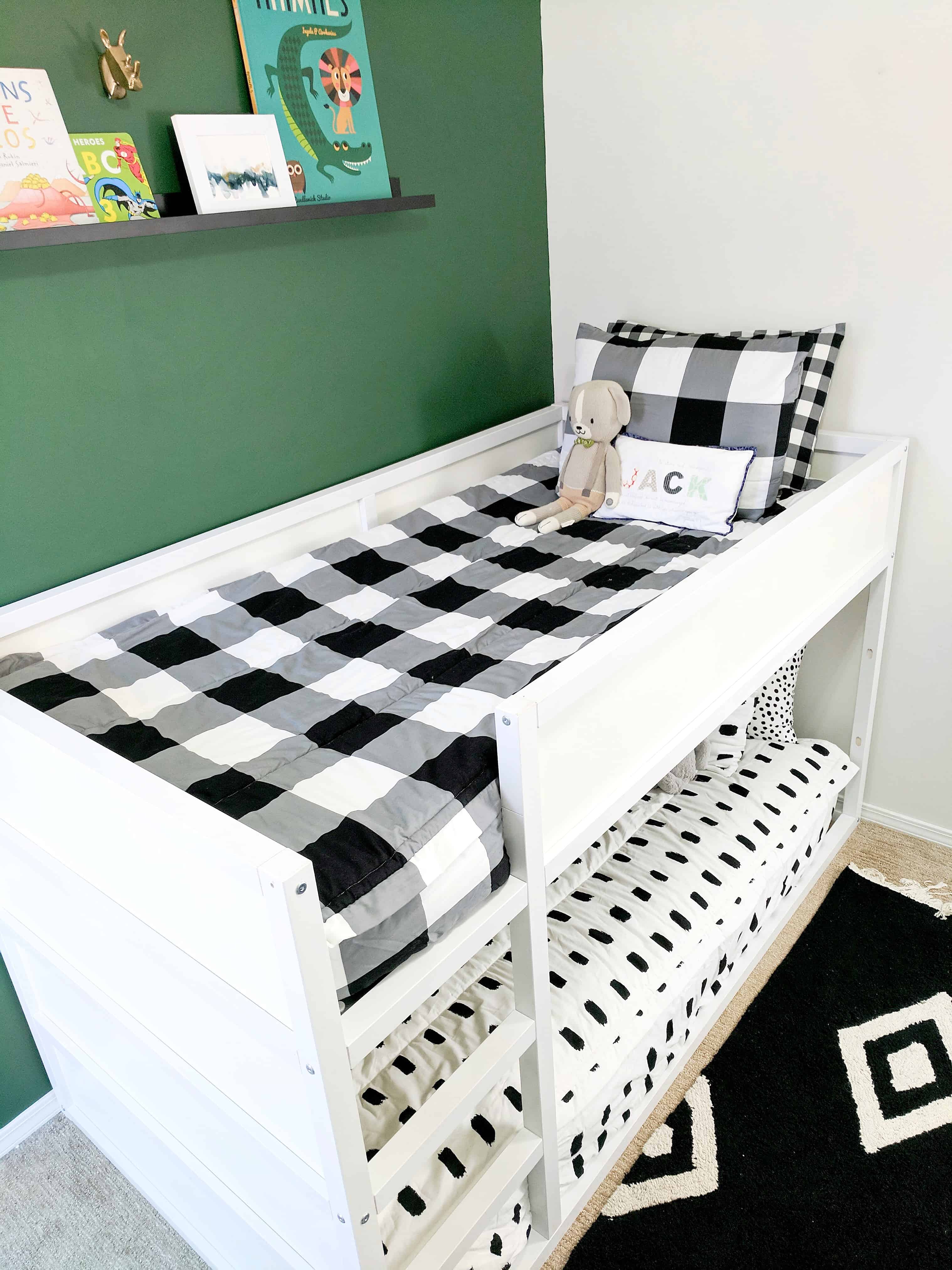 Green wall with white bunk beds and black and white beddys bedding | Modern Little Boys Room