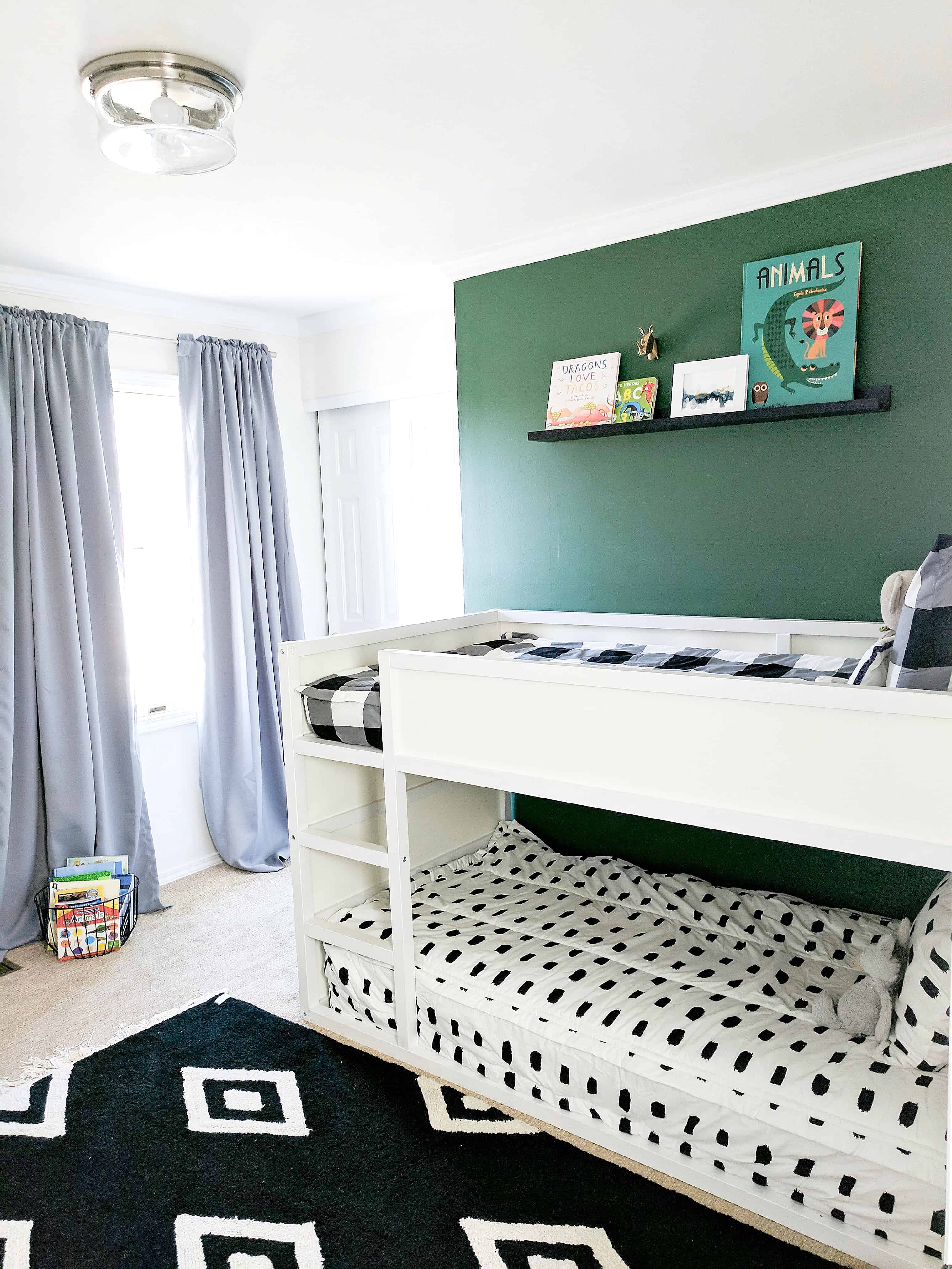 white bunk bed with green wall and black and white bedding | Modern Little Boys Room