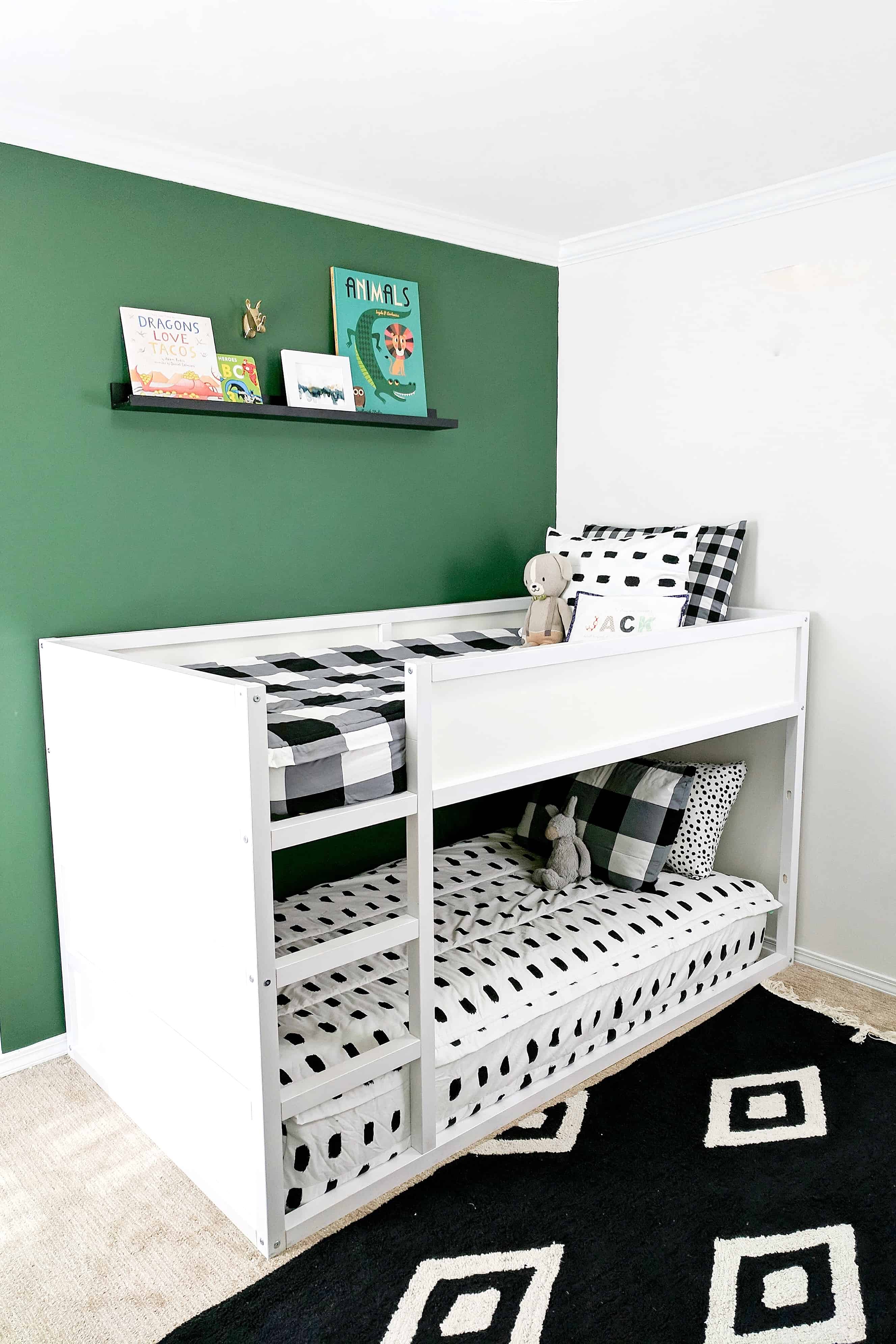 green wall with white bunk beds and black and white bedding | Modern Little Boys Room