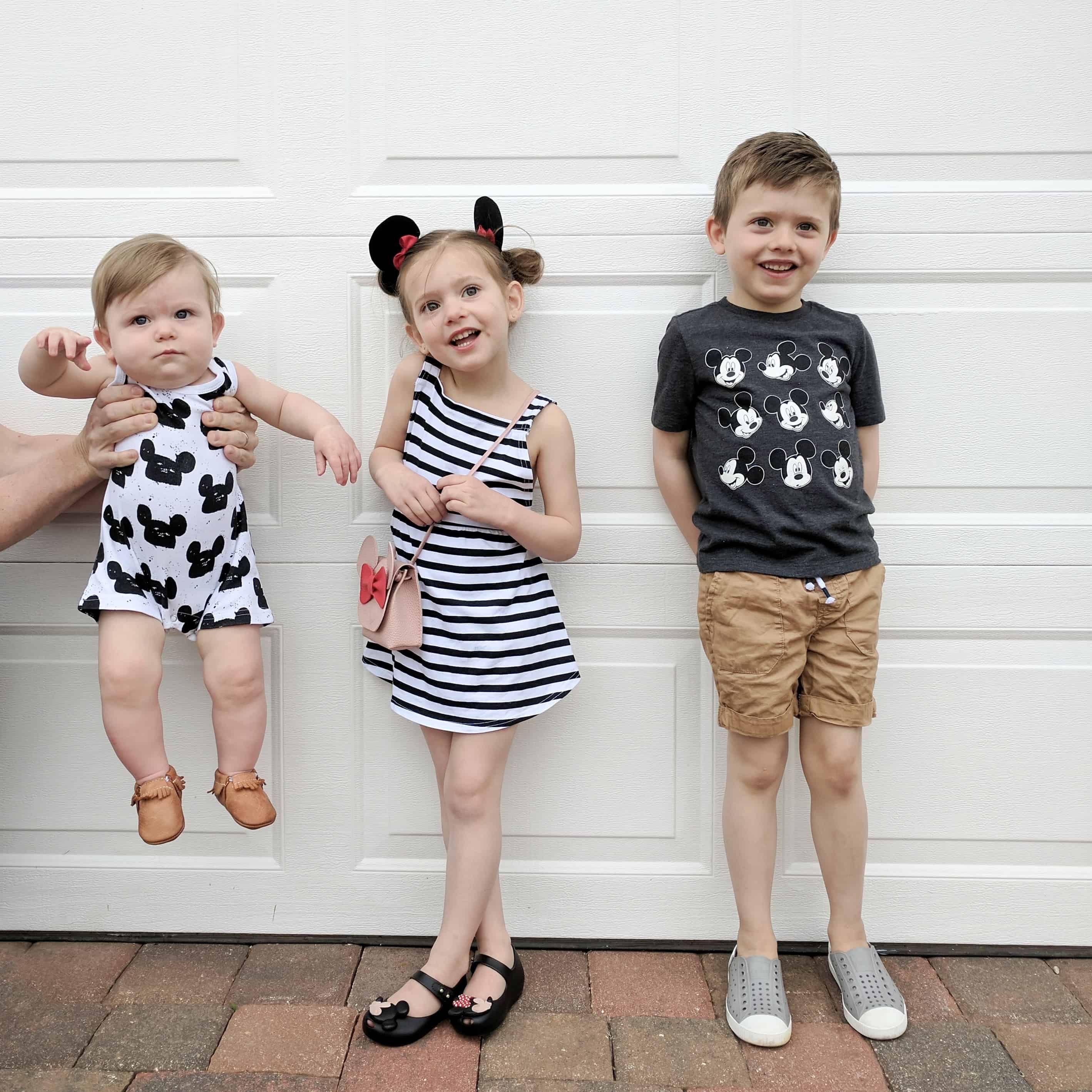 three kids in Disney outfits June and January and modern burlap