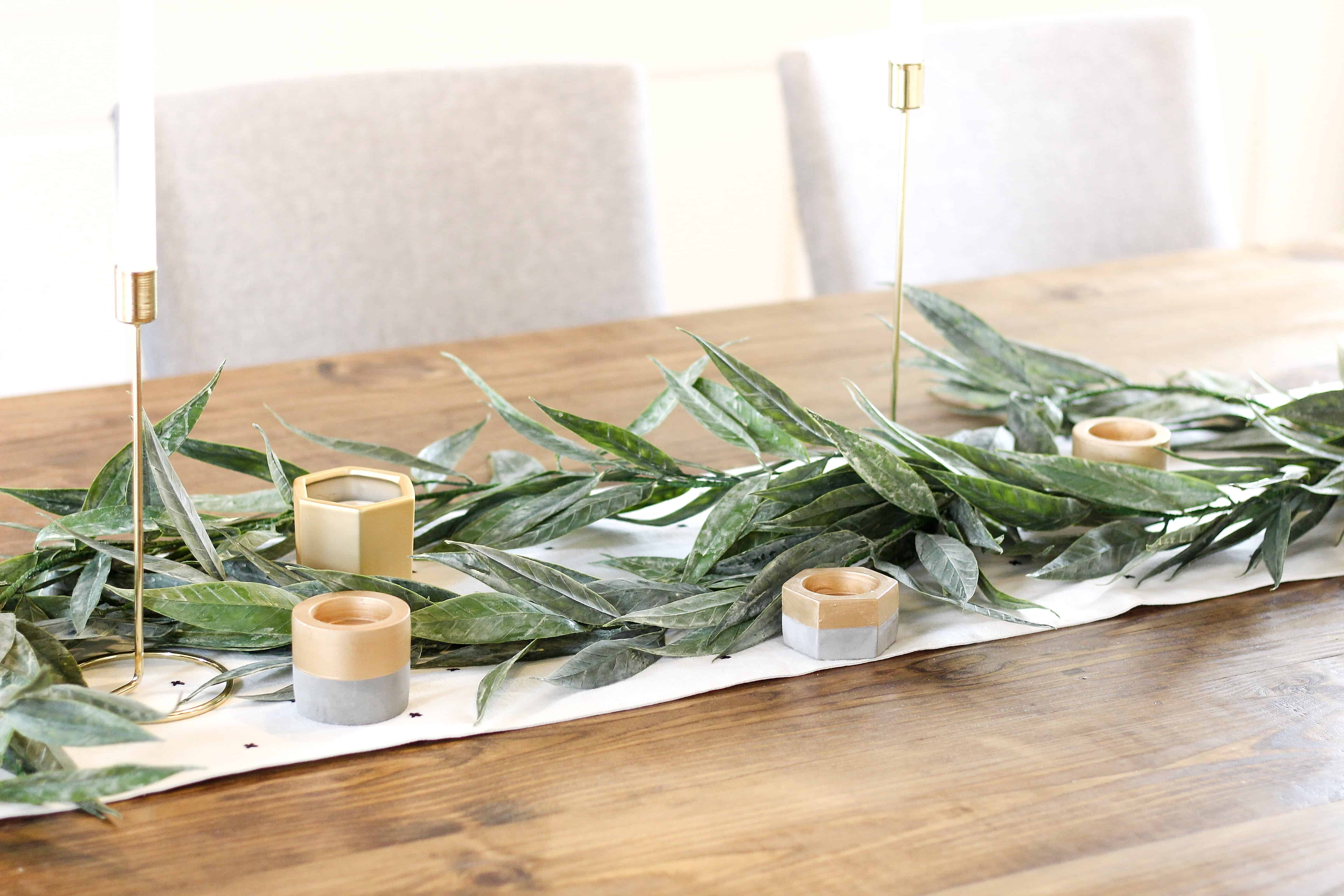 table with greenery and gold accents | Modern Dining Room with Dark Ceiling