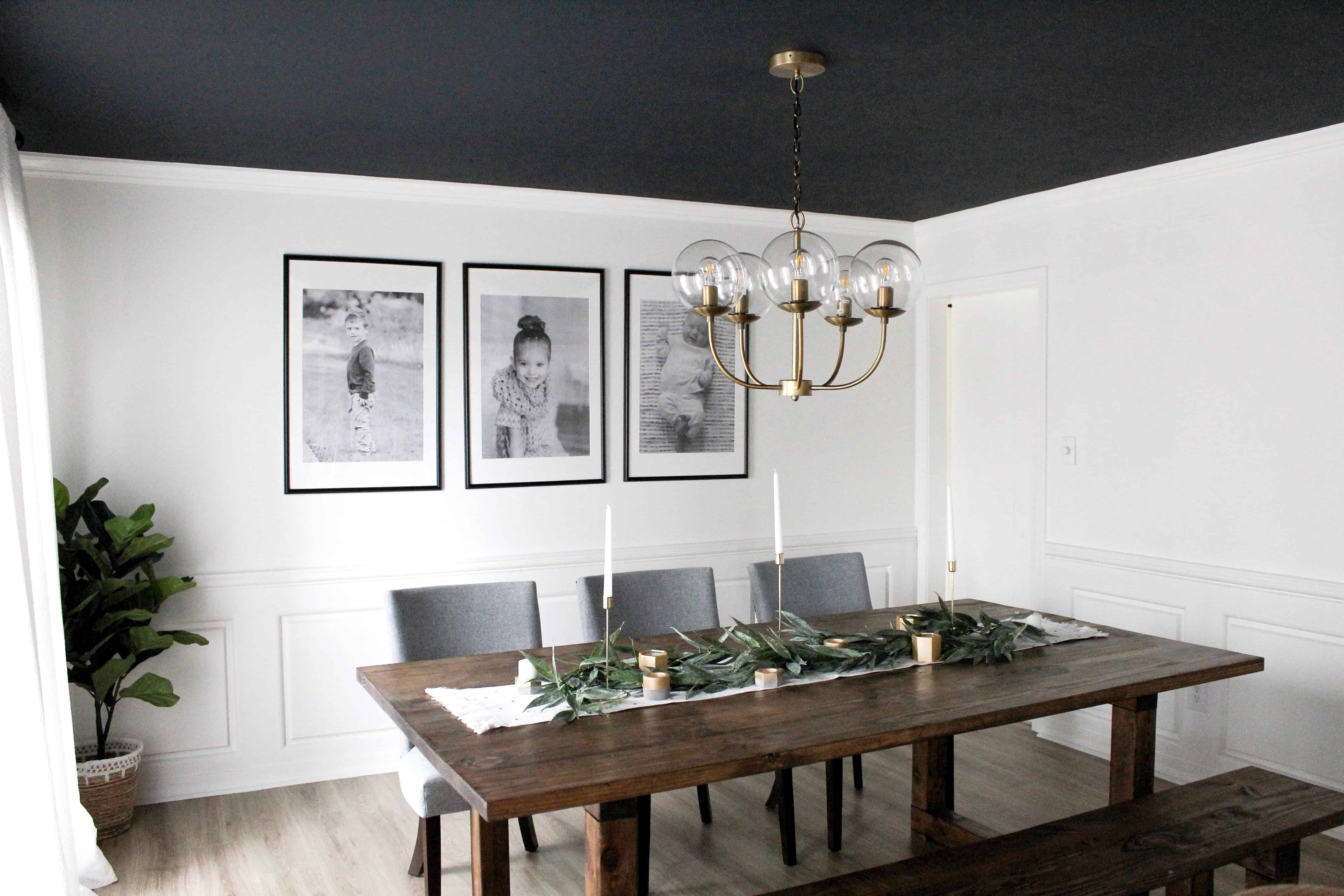 dining room with dark ceiling and large black and white prints | Modern Dining Room with Dark Ceiling