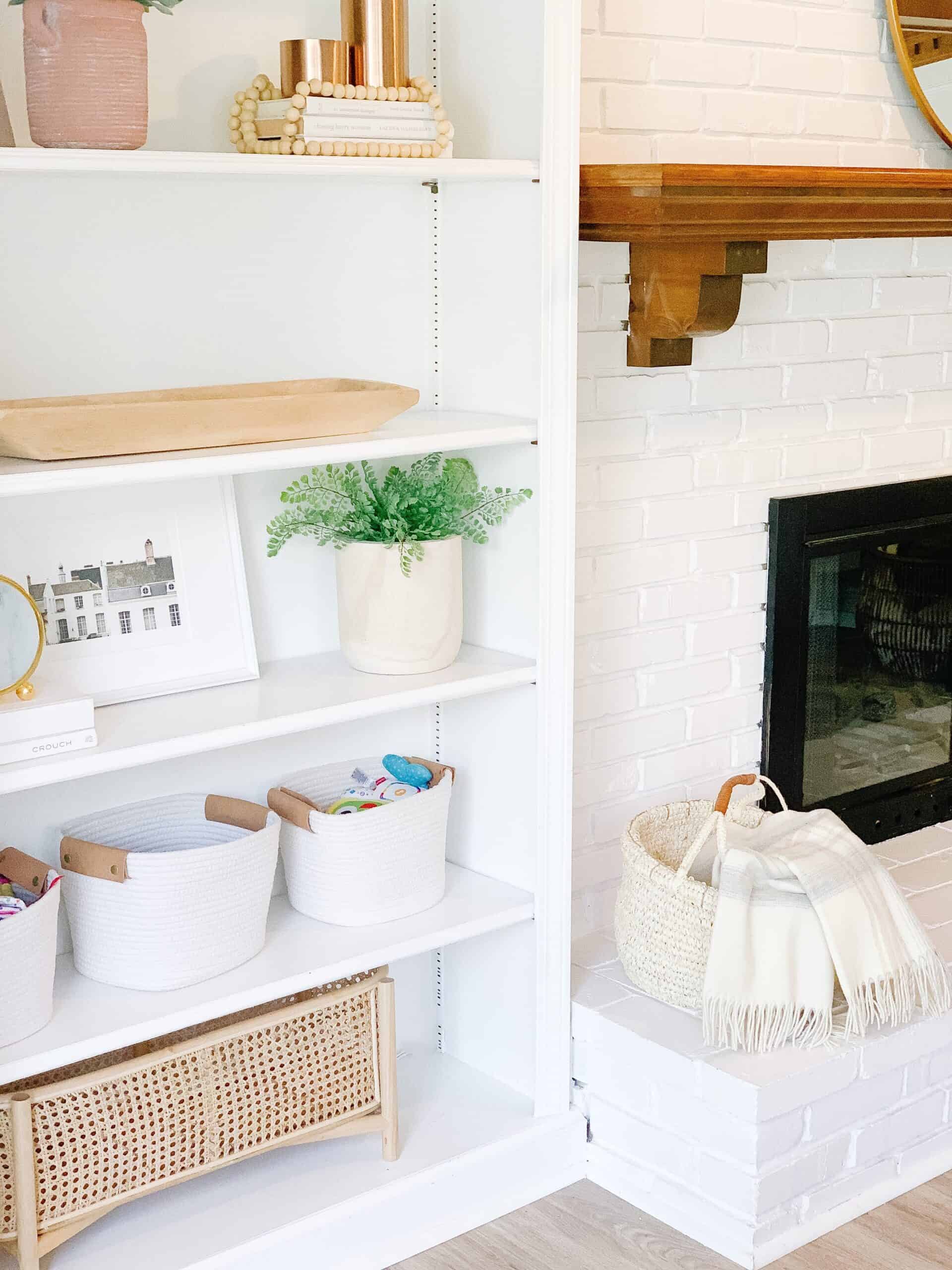 white brick fireplace with basket