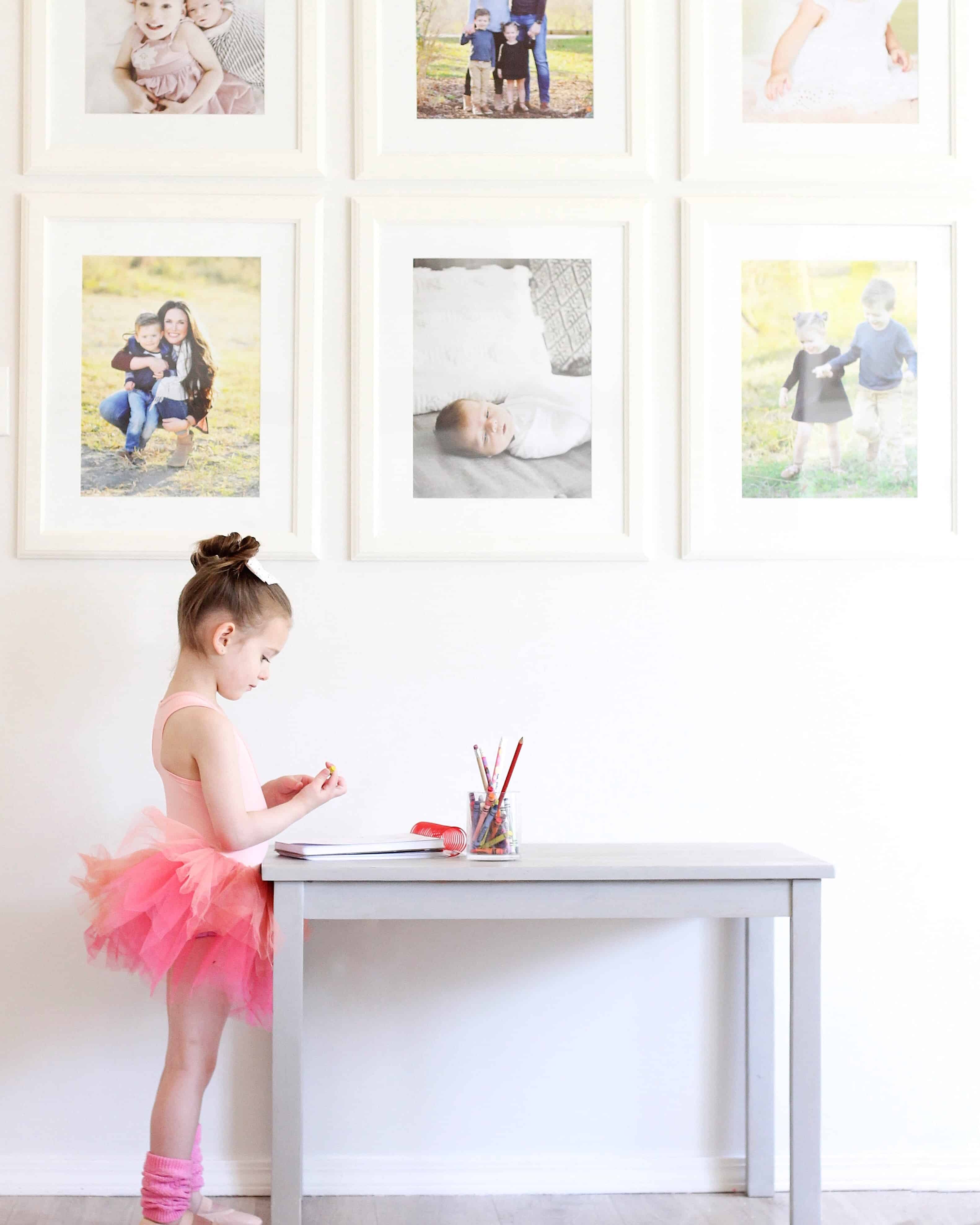 toddler girl at table wearing plum tutu