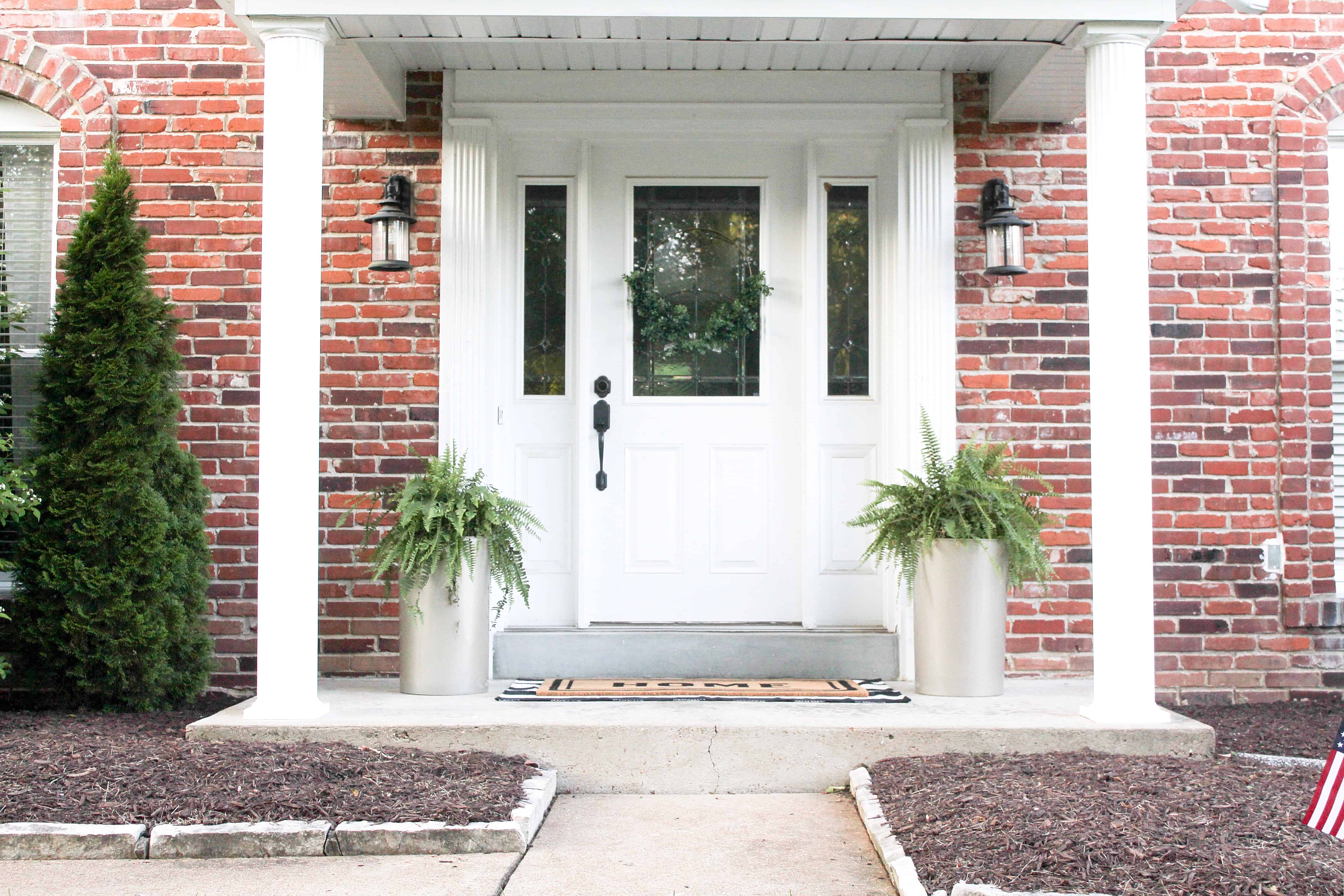 front porch with large gold planters | Trash Can Planter Hack 