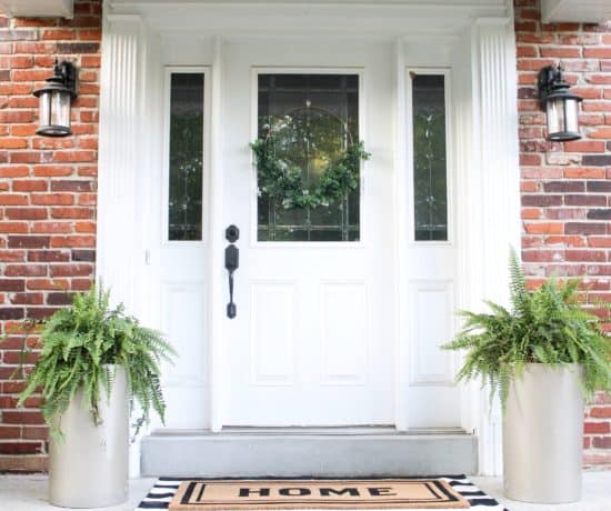 front porch with large gold planters