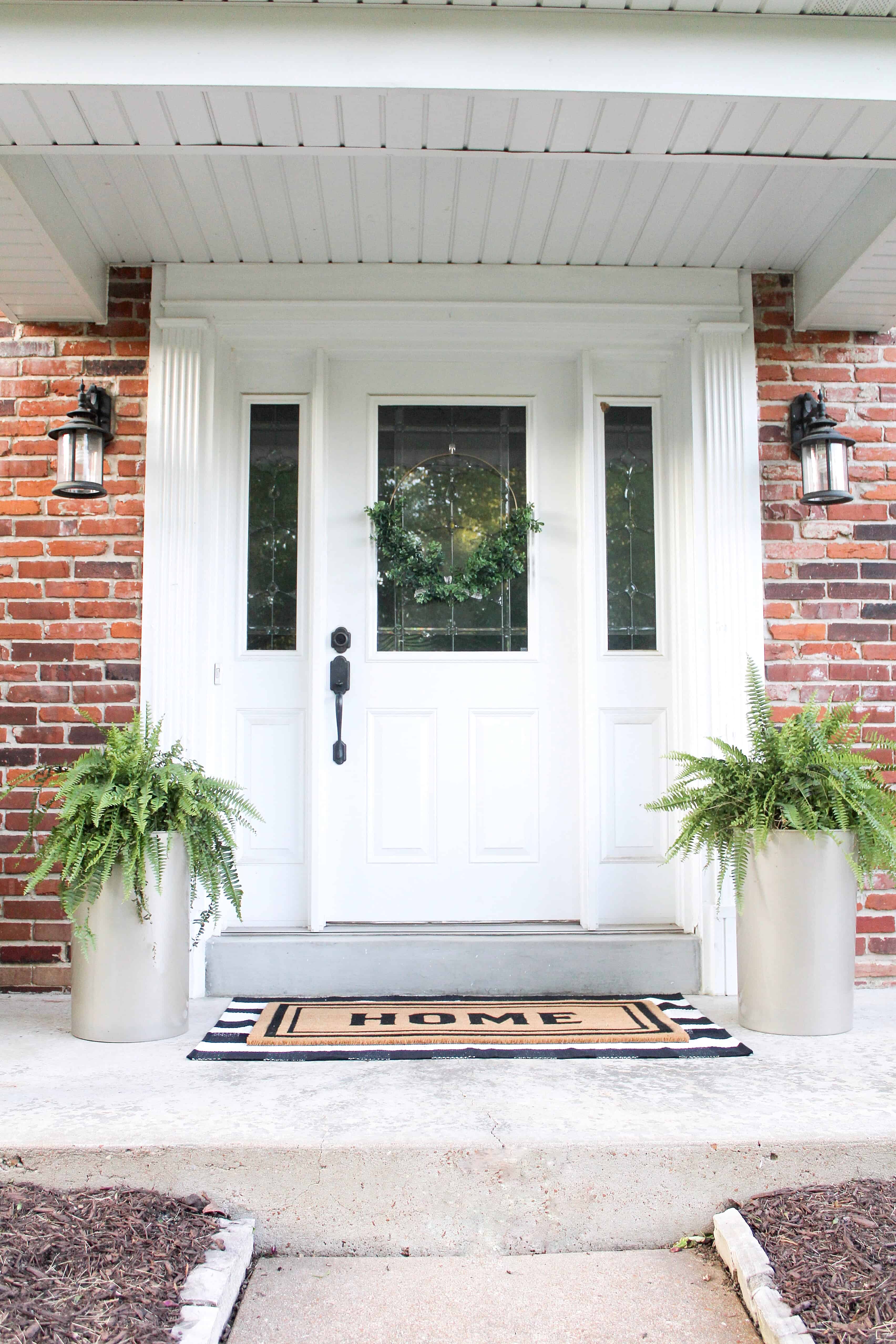 front porch with large gold planters | Trash Can Planter Hack 