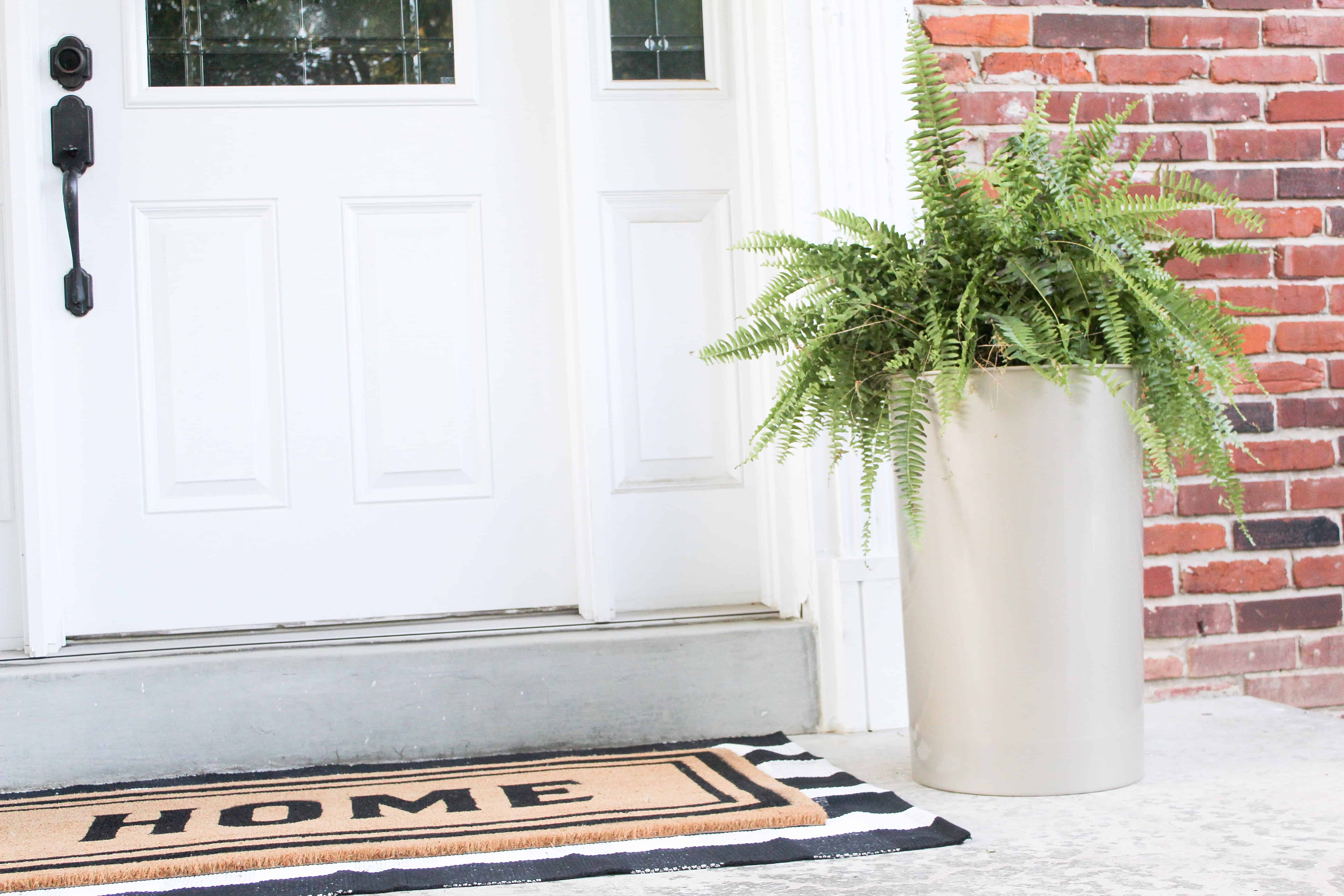 large gold planter and layered rugs | Trash Can Planter Hack 