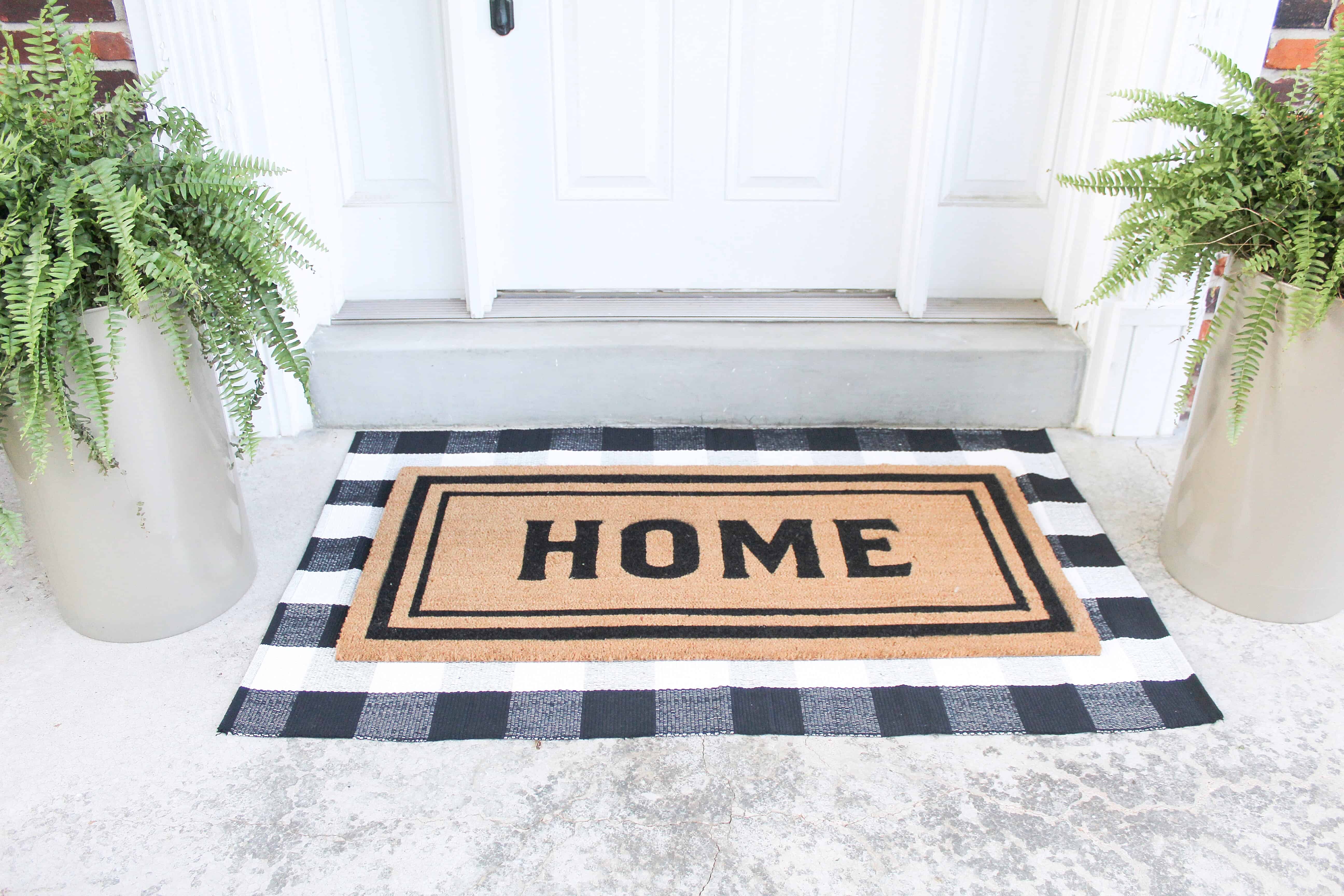 front porch with layered rugs | Trash Can Planter Hack 