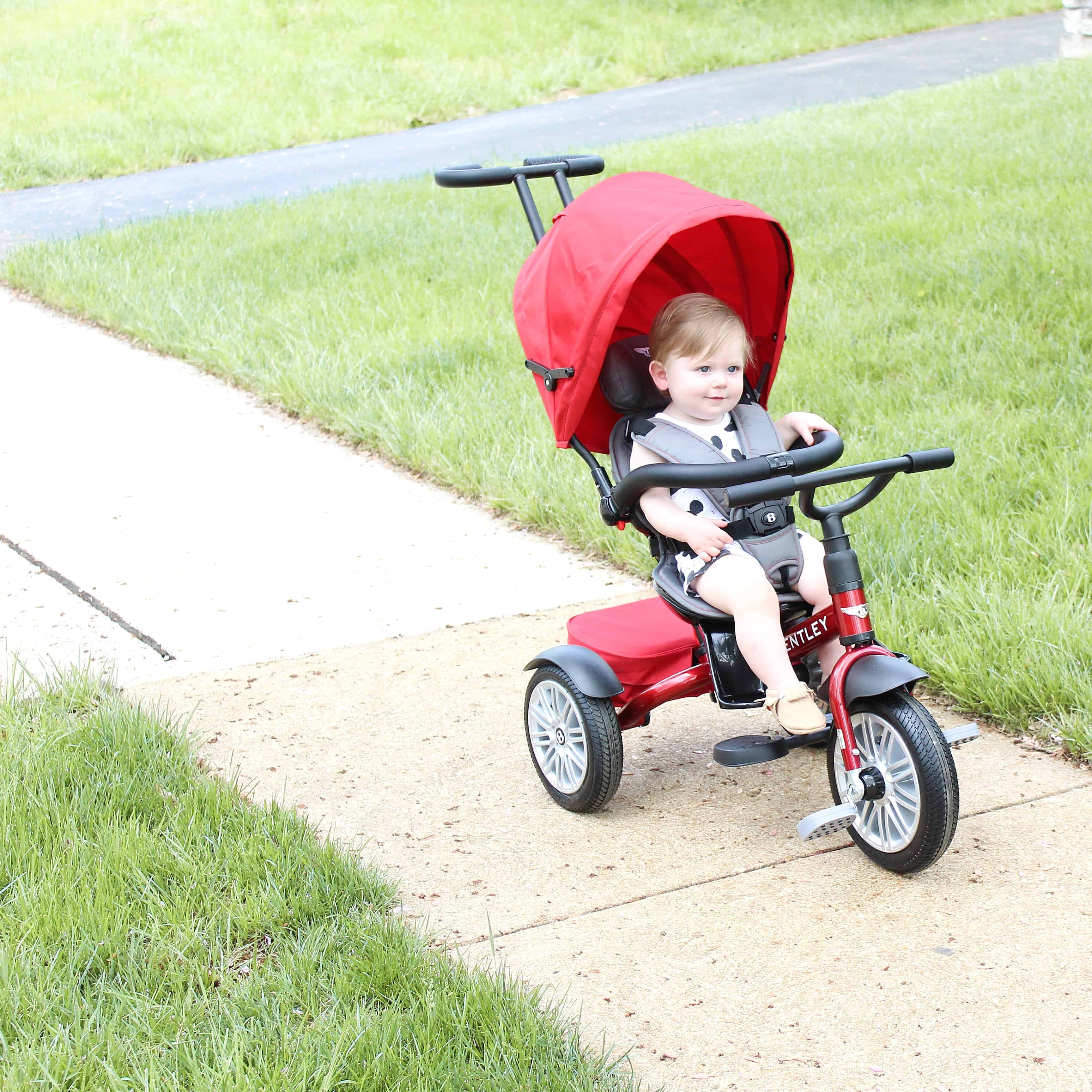 baby on red Bentley trike | One Year Old Boy Gift Guide 