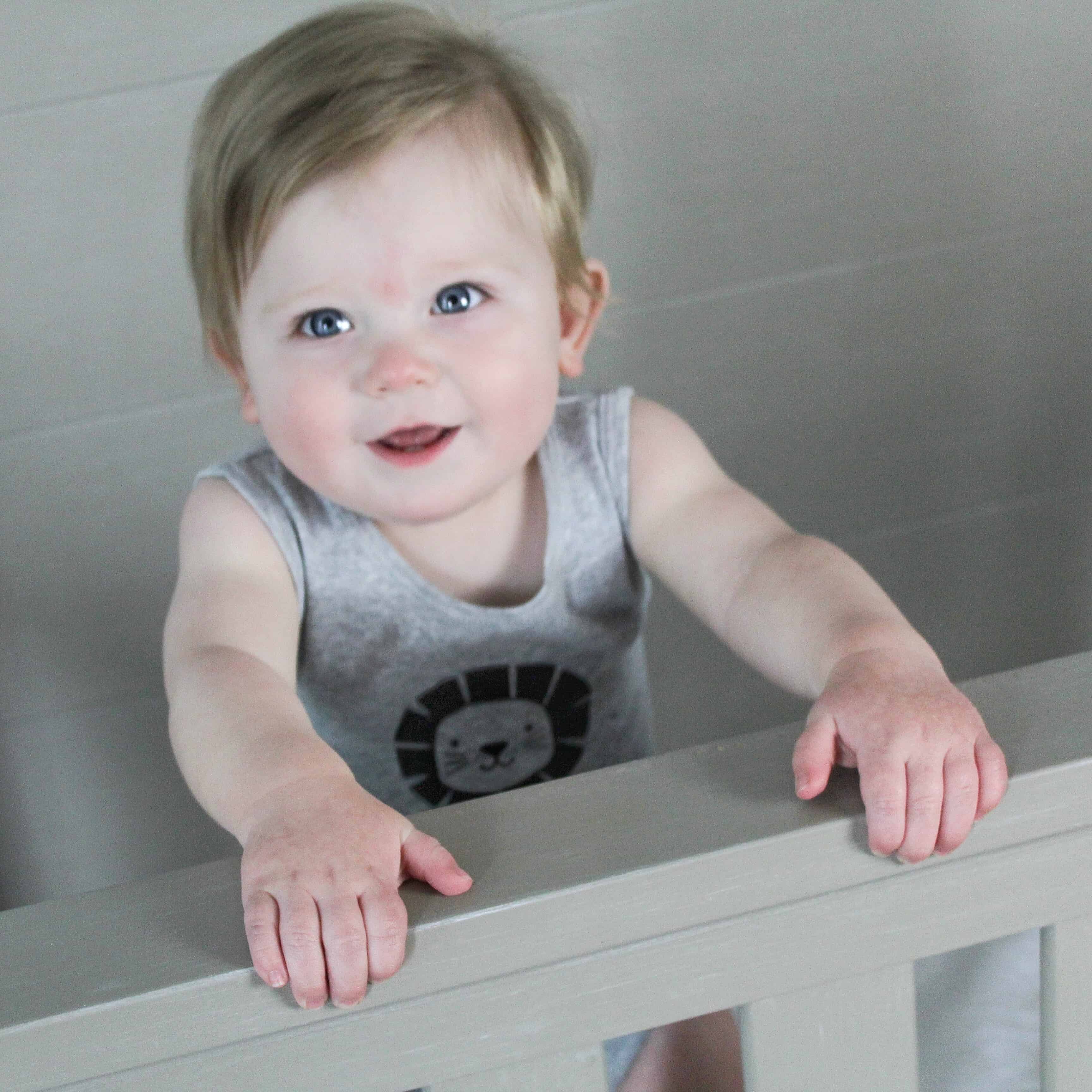 baby standing in crib