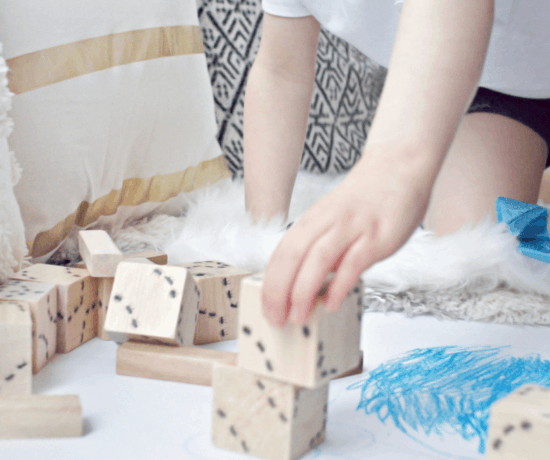toddler boy playing with blocks