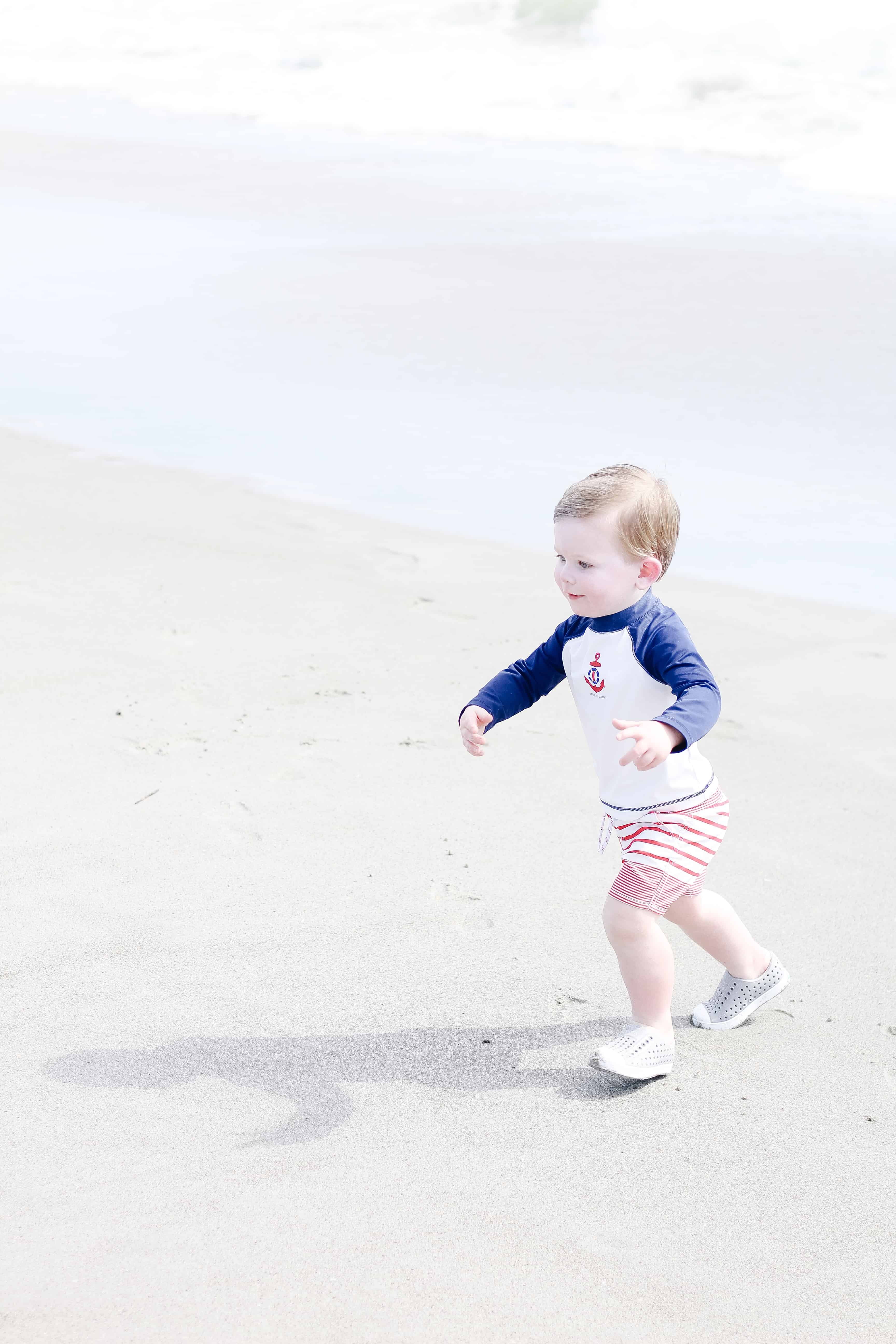 Toddler Boy running on beach