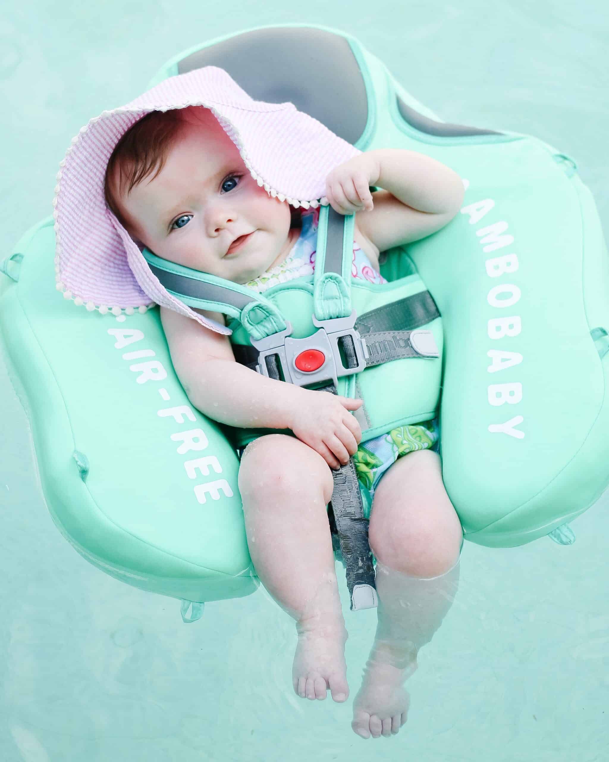 baby girl in pool float