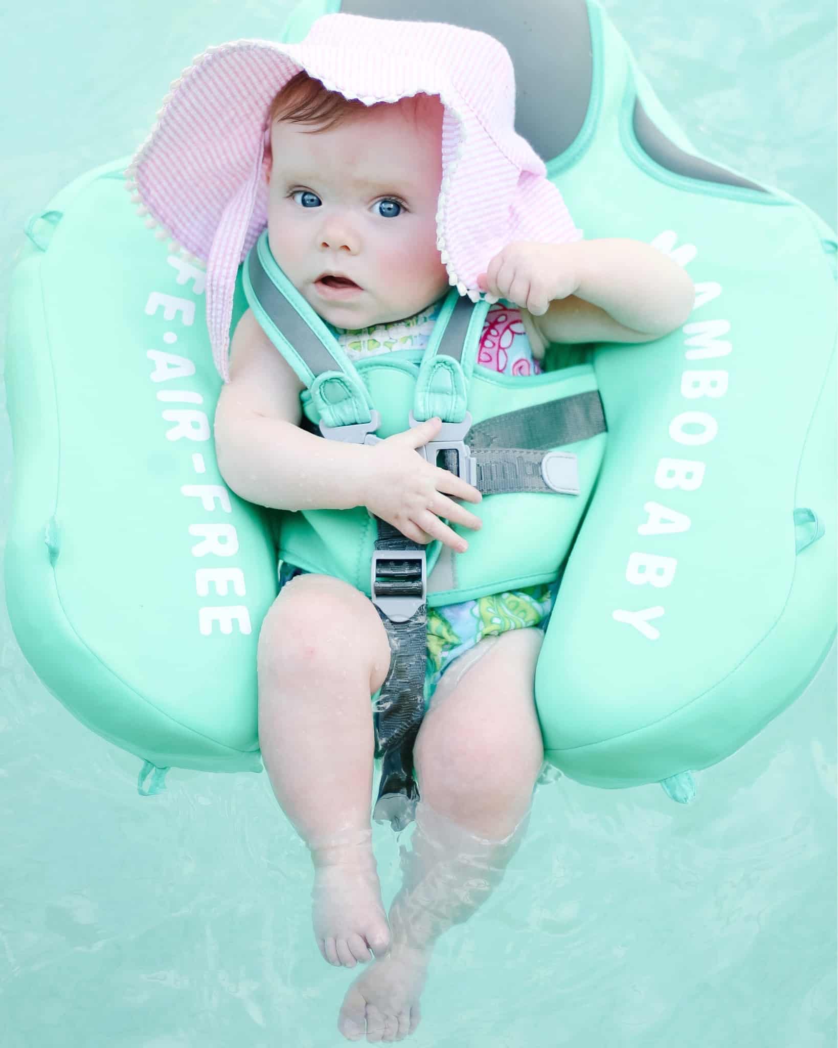 baby girl in mint pool float