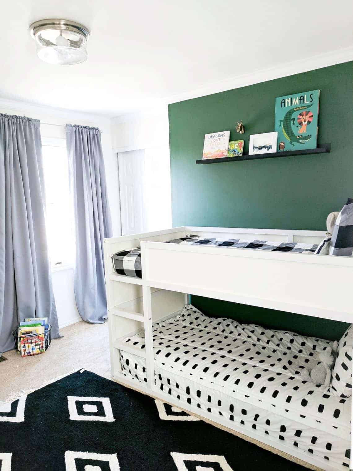 Boys bedroom with buddy's bedding and green wall