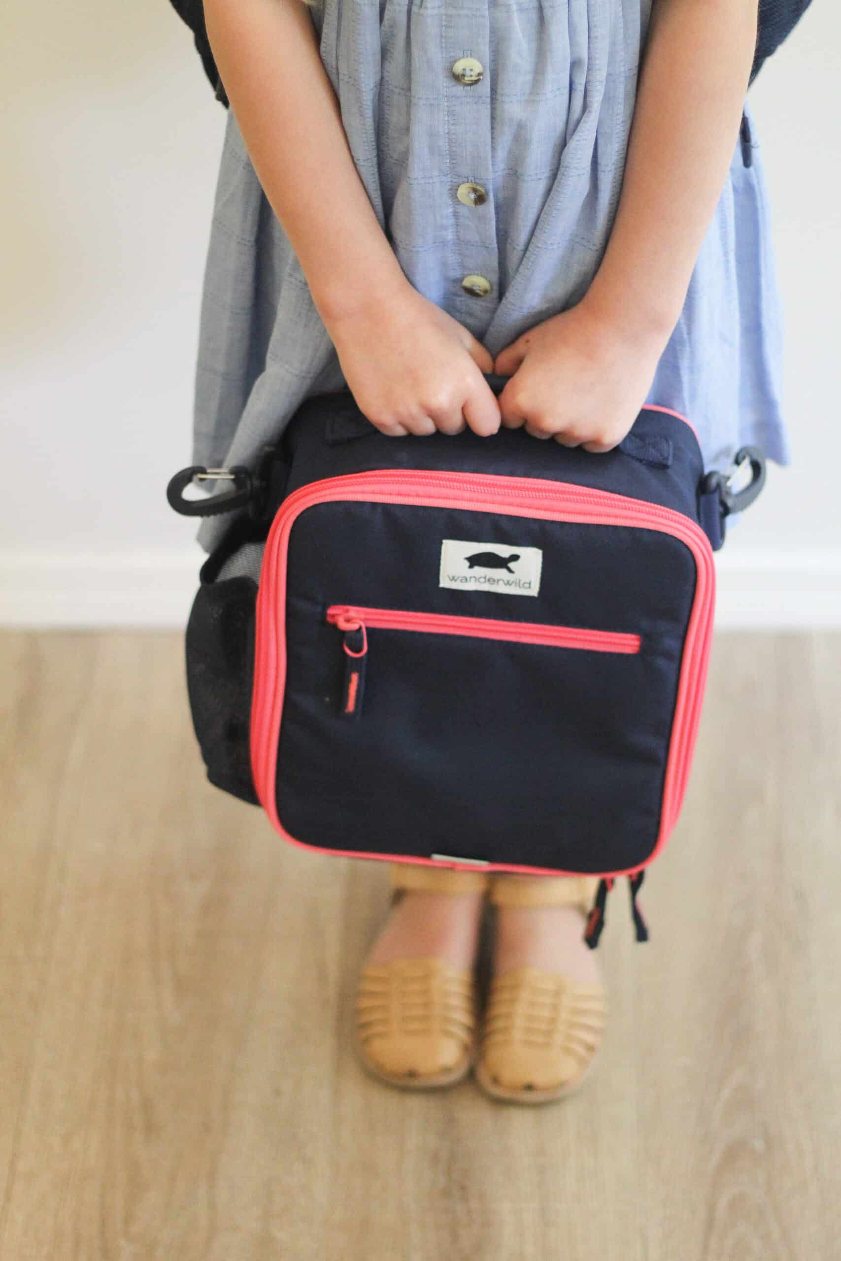 little girl with pink Wanderwild backpack