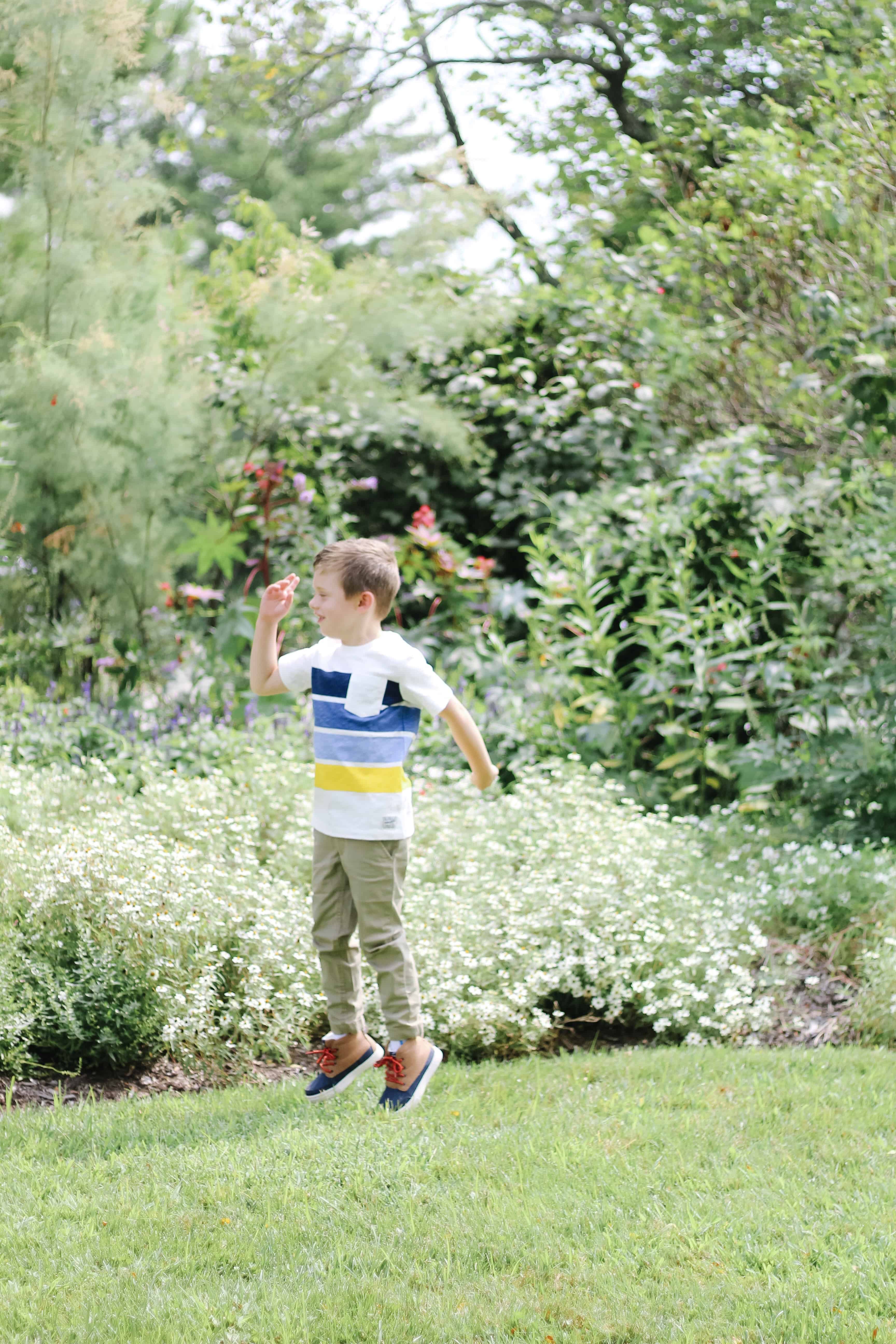 toddler boy jumping in OshKosh