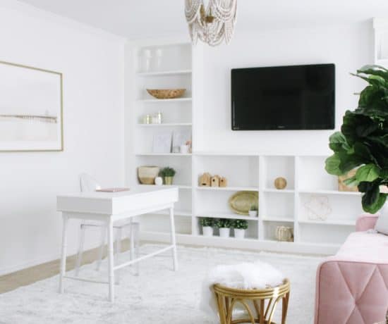 bright white home office with pink couch