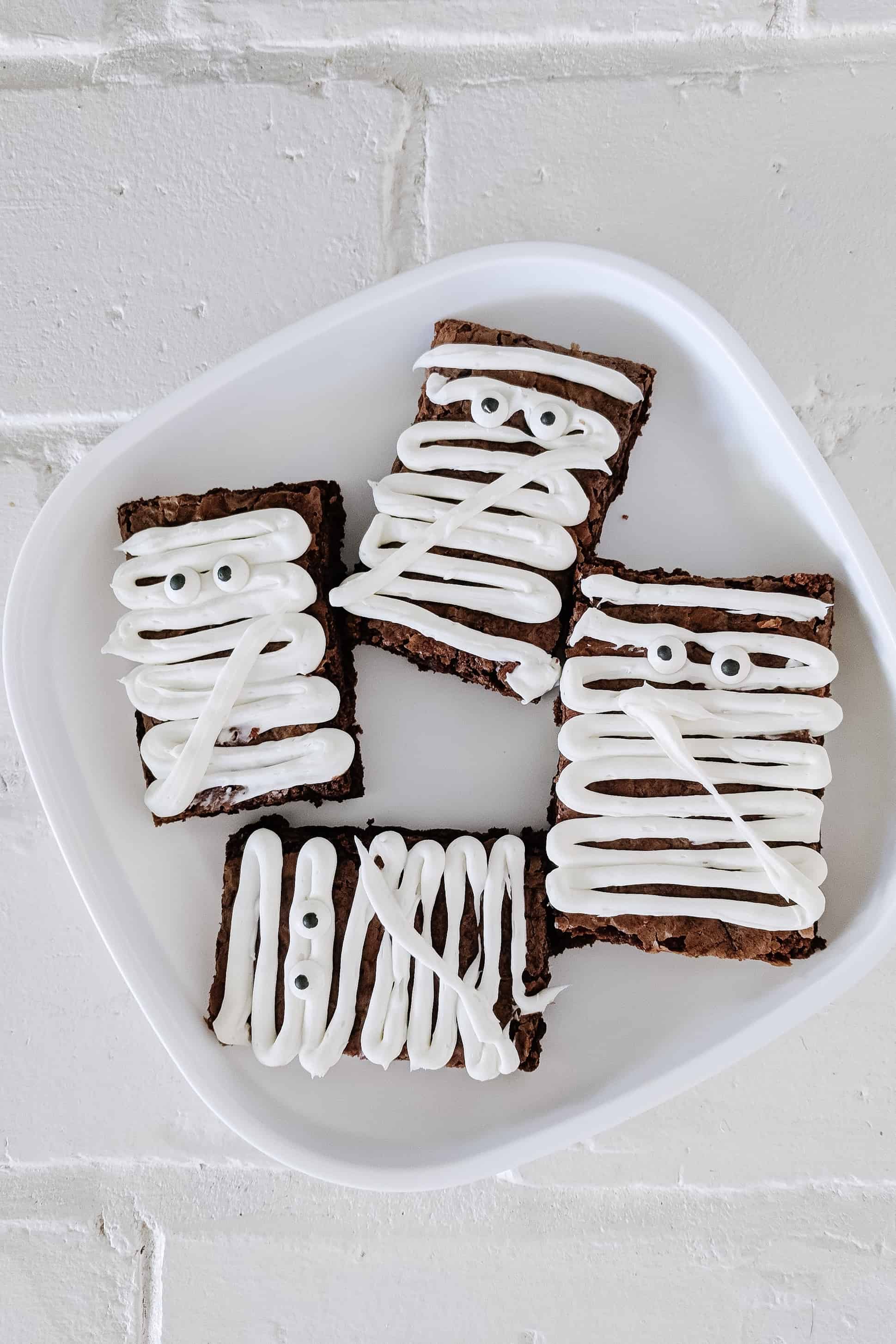 mummy brownies on a white plate