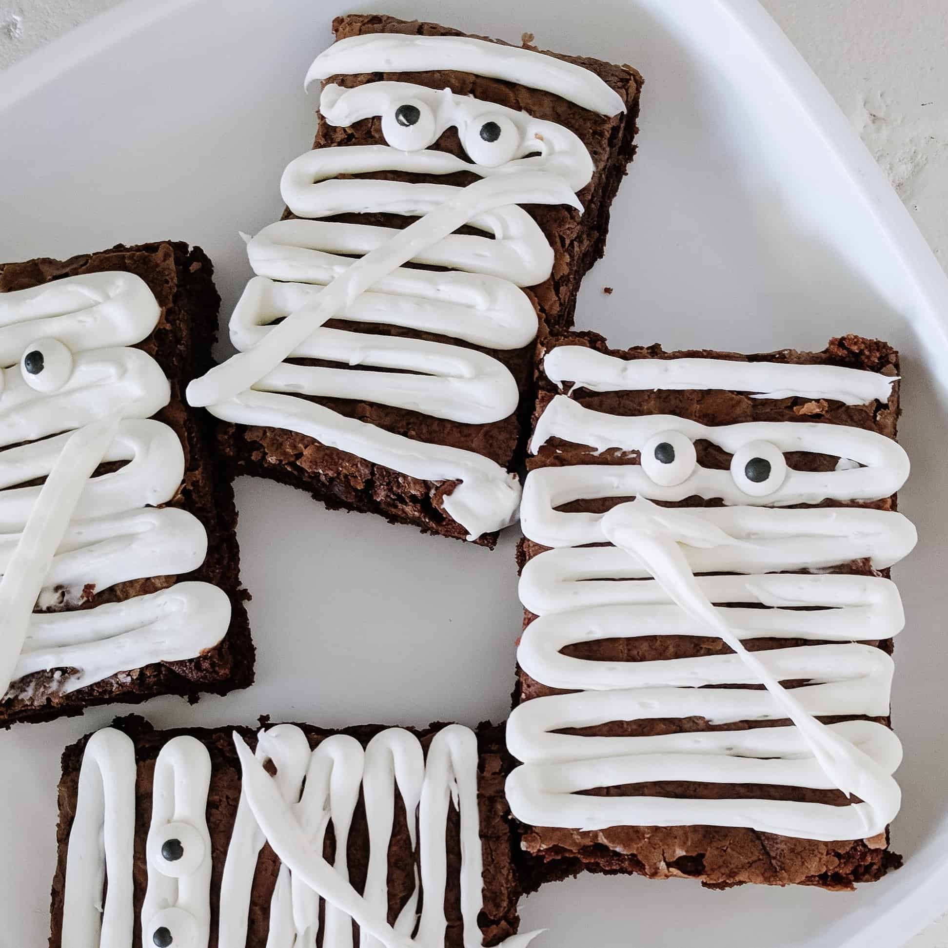 Mummy brownies on white plate