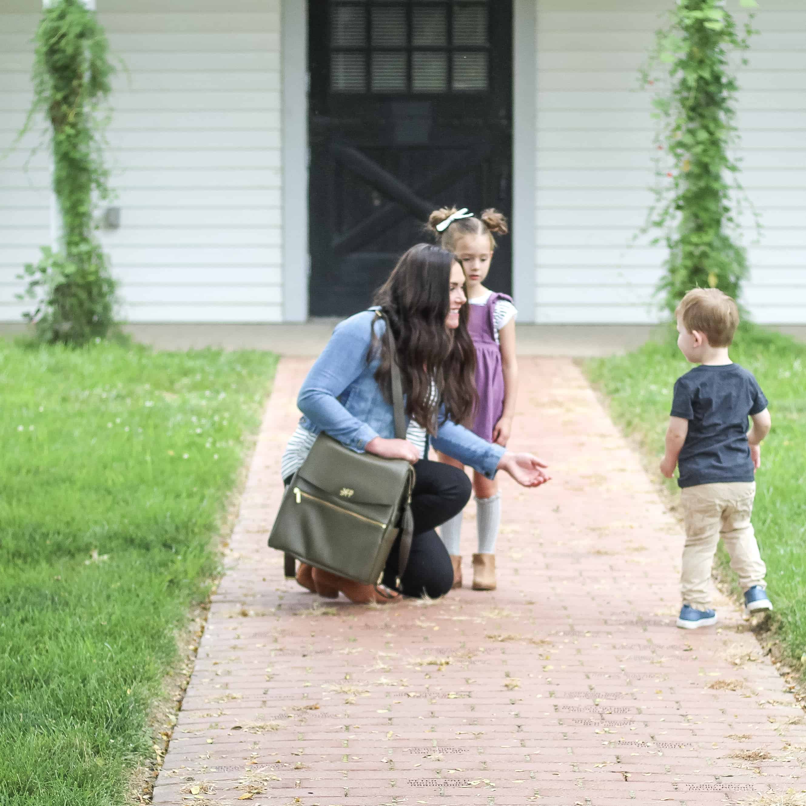 mom with 2 kids and olive freshly picked diaper bag