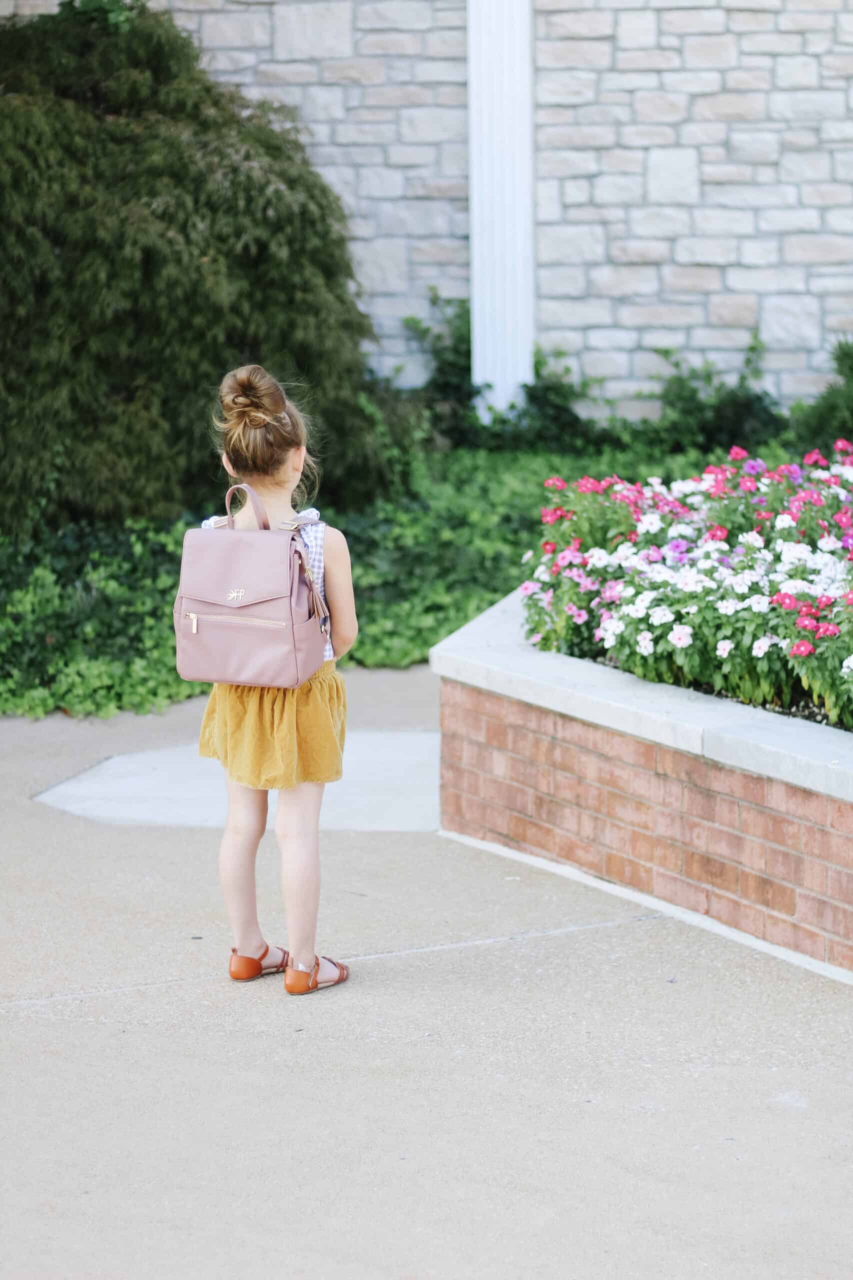 toddler in Mini Dusty Rose Freshly Picked bag