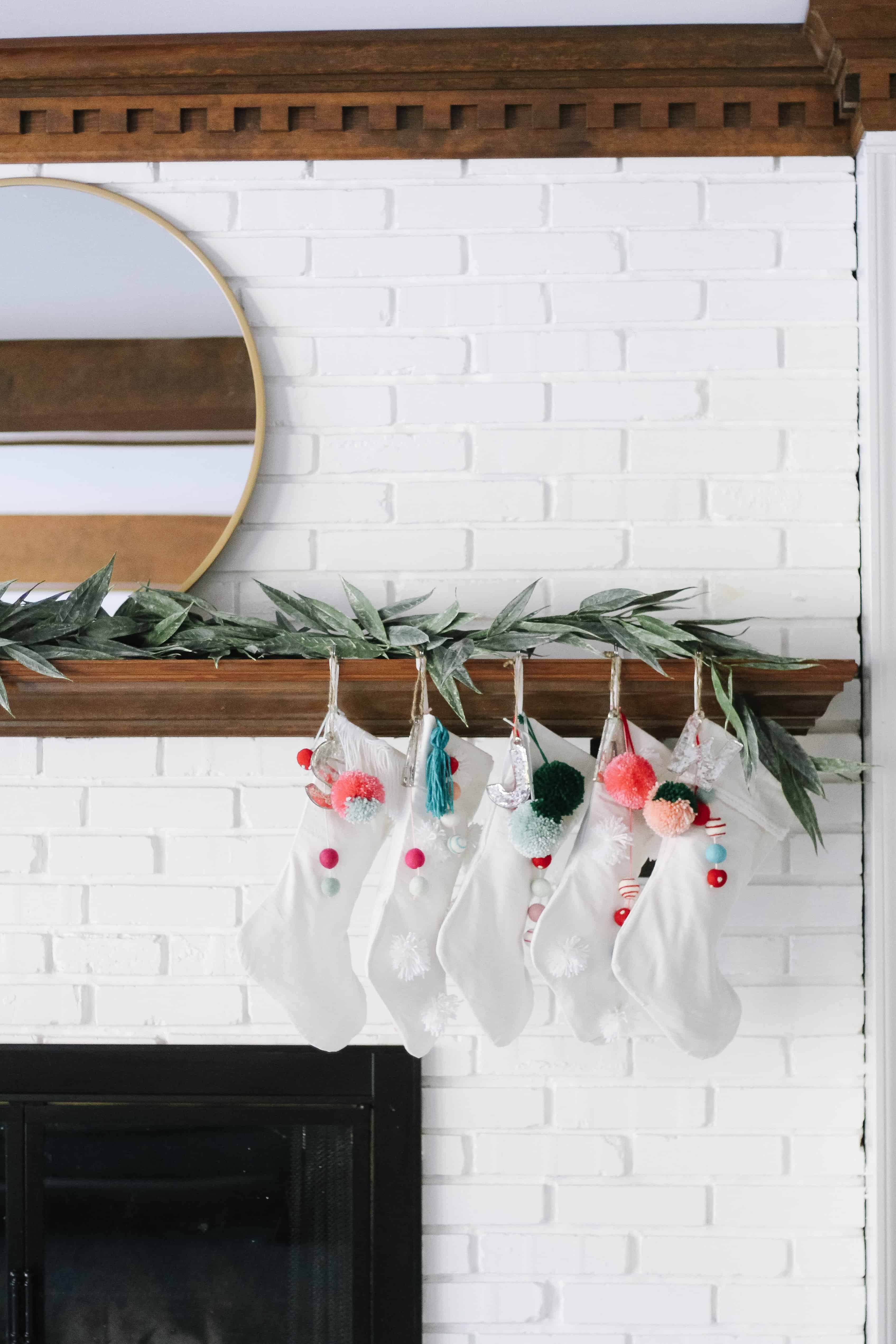 white stockings hung with colorful poms