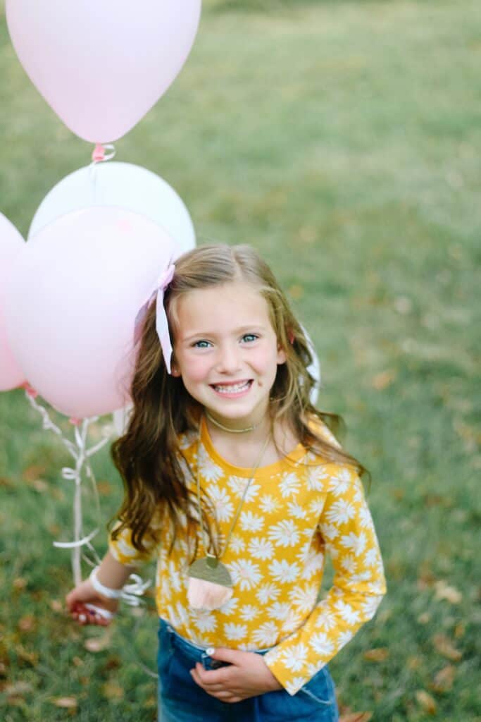 6 year old girl with balloons