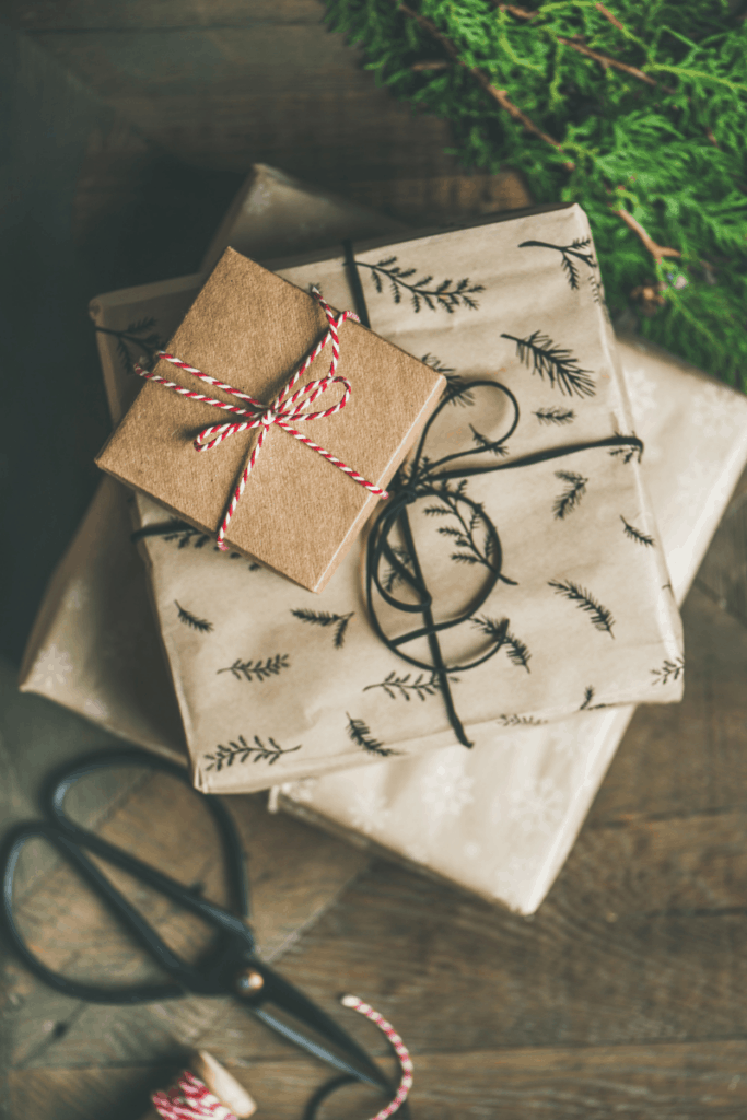 stack of presents in tan wrapping paper