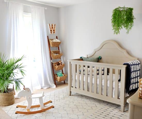 nursery with grey walls and green and navy pops