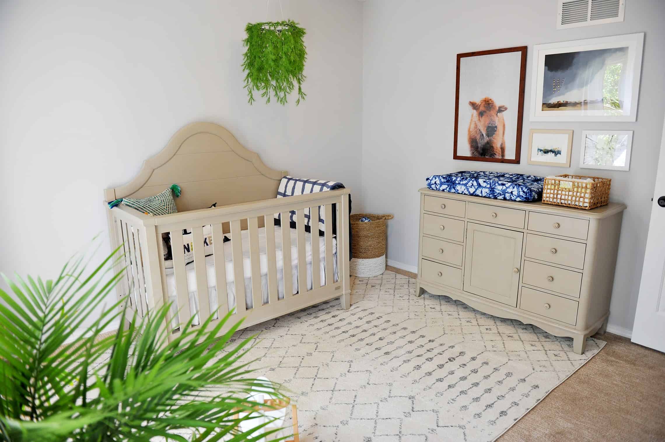 Modern nursery with greenery mobile