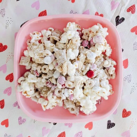 Best Toddler Valentines Day snack on a pink plate over a heart table cloth