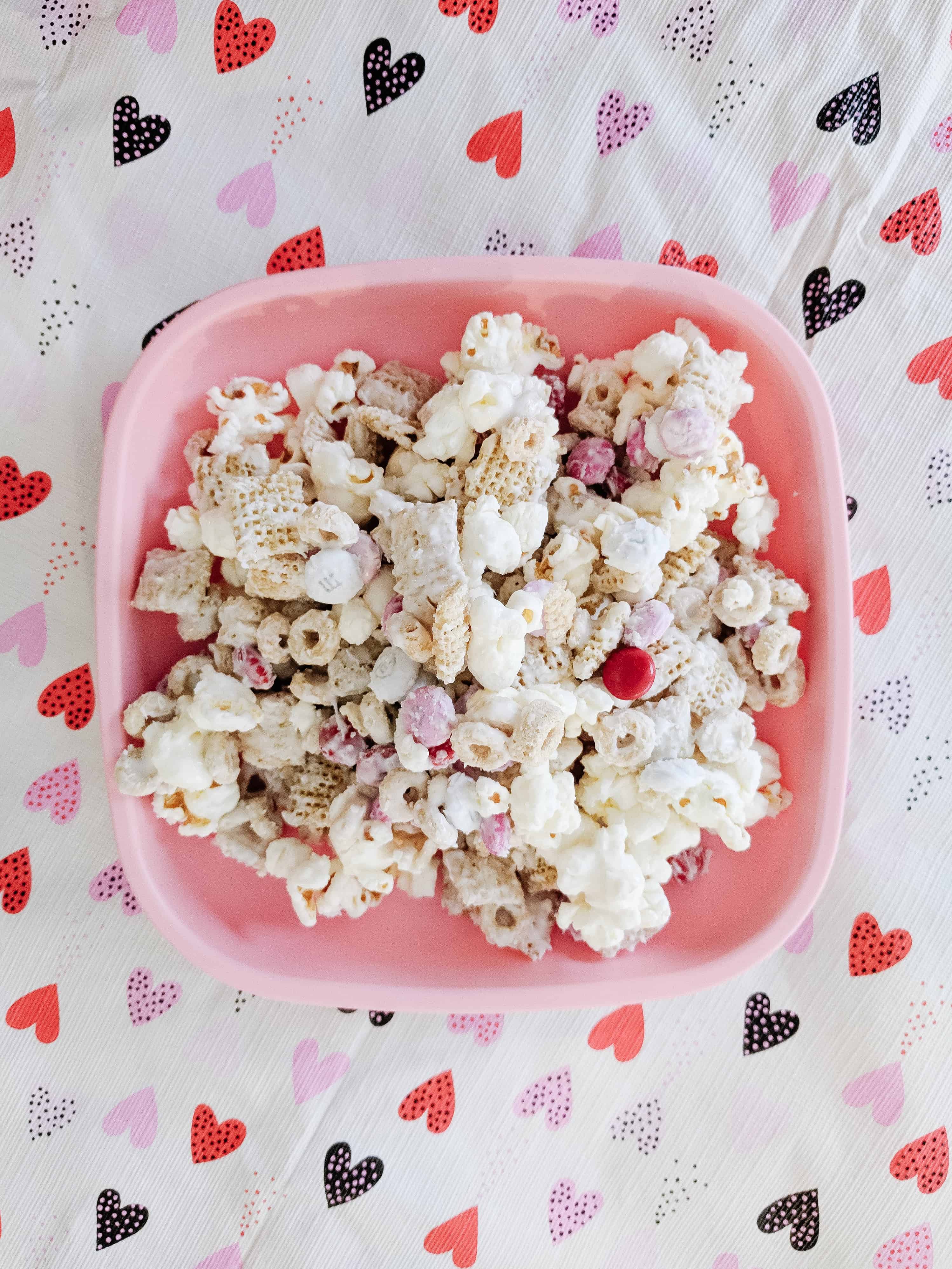 Best Toddler Valentines Day snack on a pink plate over a heart table cloth